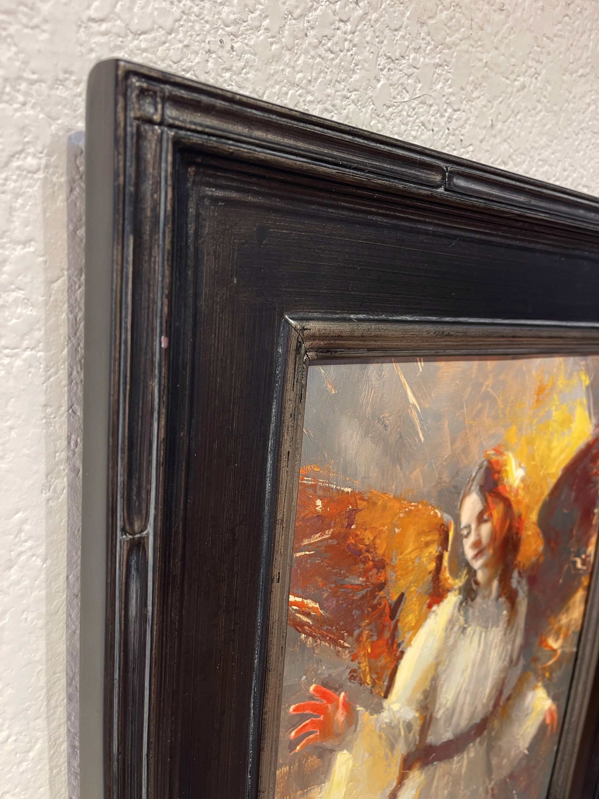 A painting of an angel in a white dress.