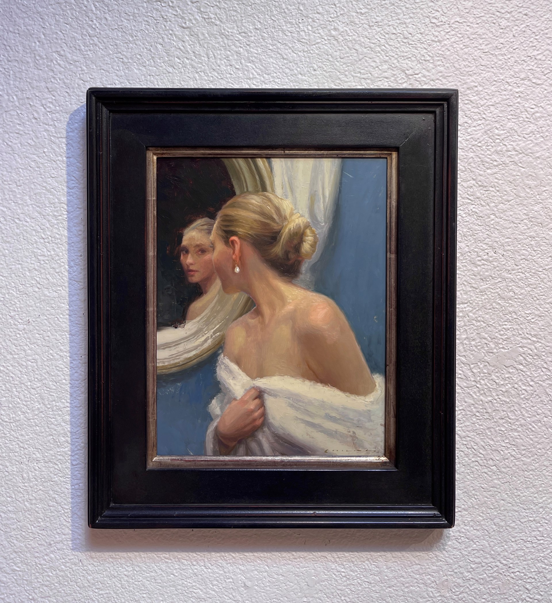 A painting of a woman looking at herself in the mirror.