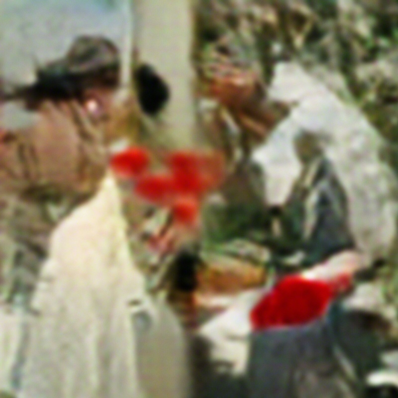 A couple of men in military uniforms standing next to each other.