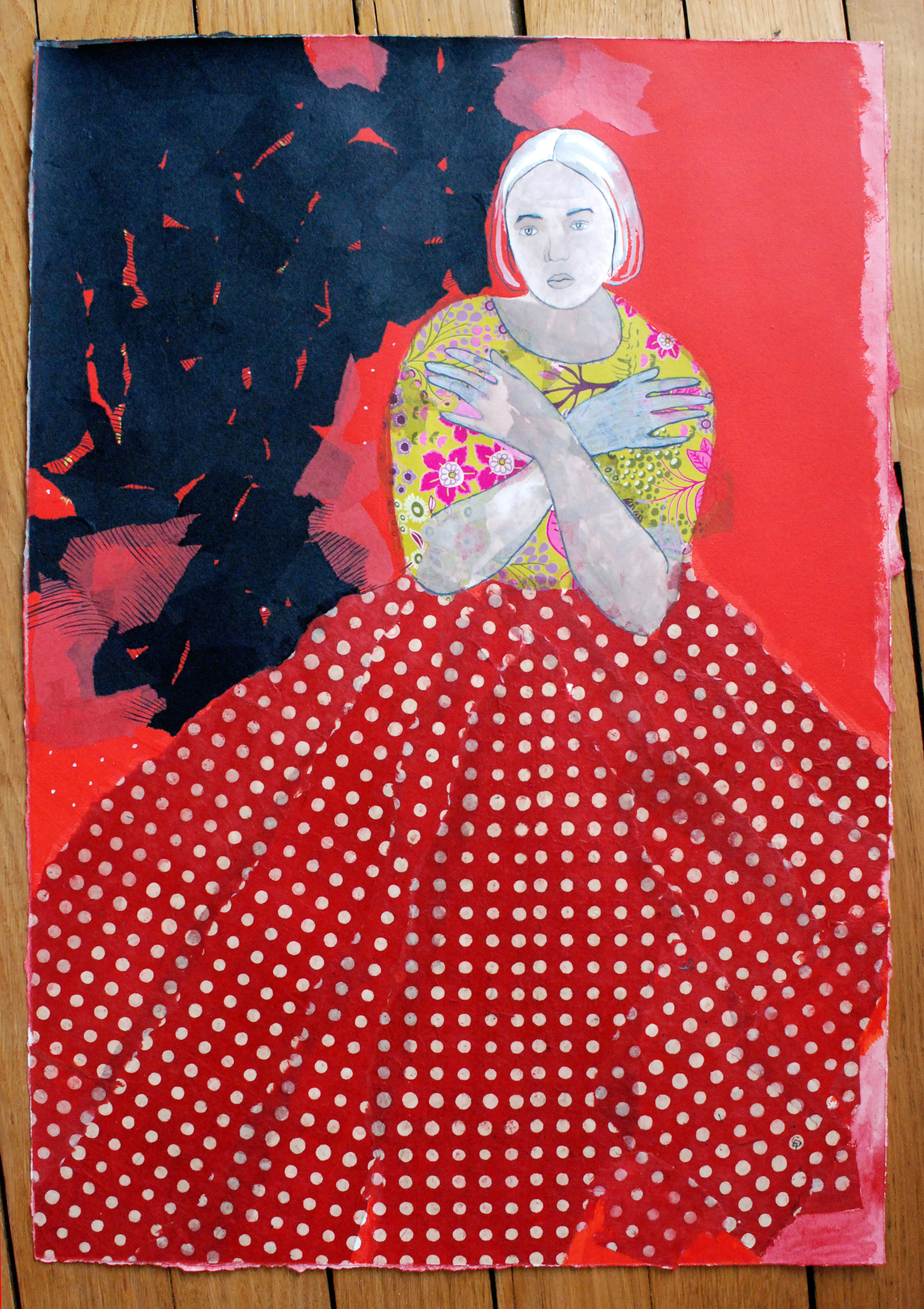 A painting of a woman in a red dress on a wooden surface.