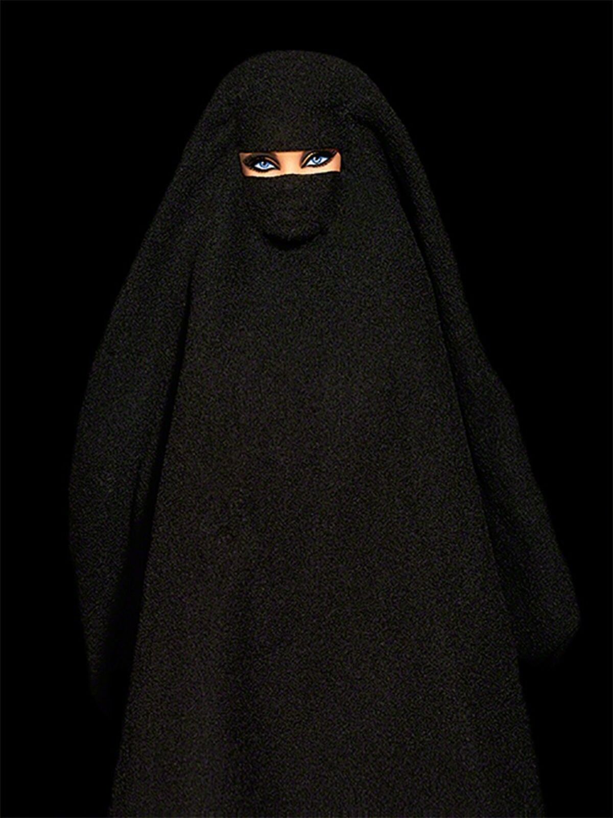 A barbie doll wearing a black corset and stockings.