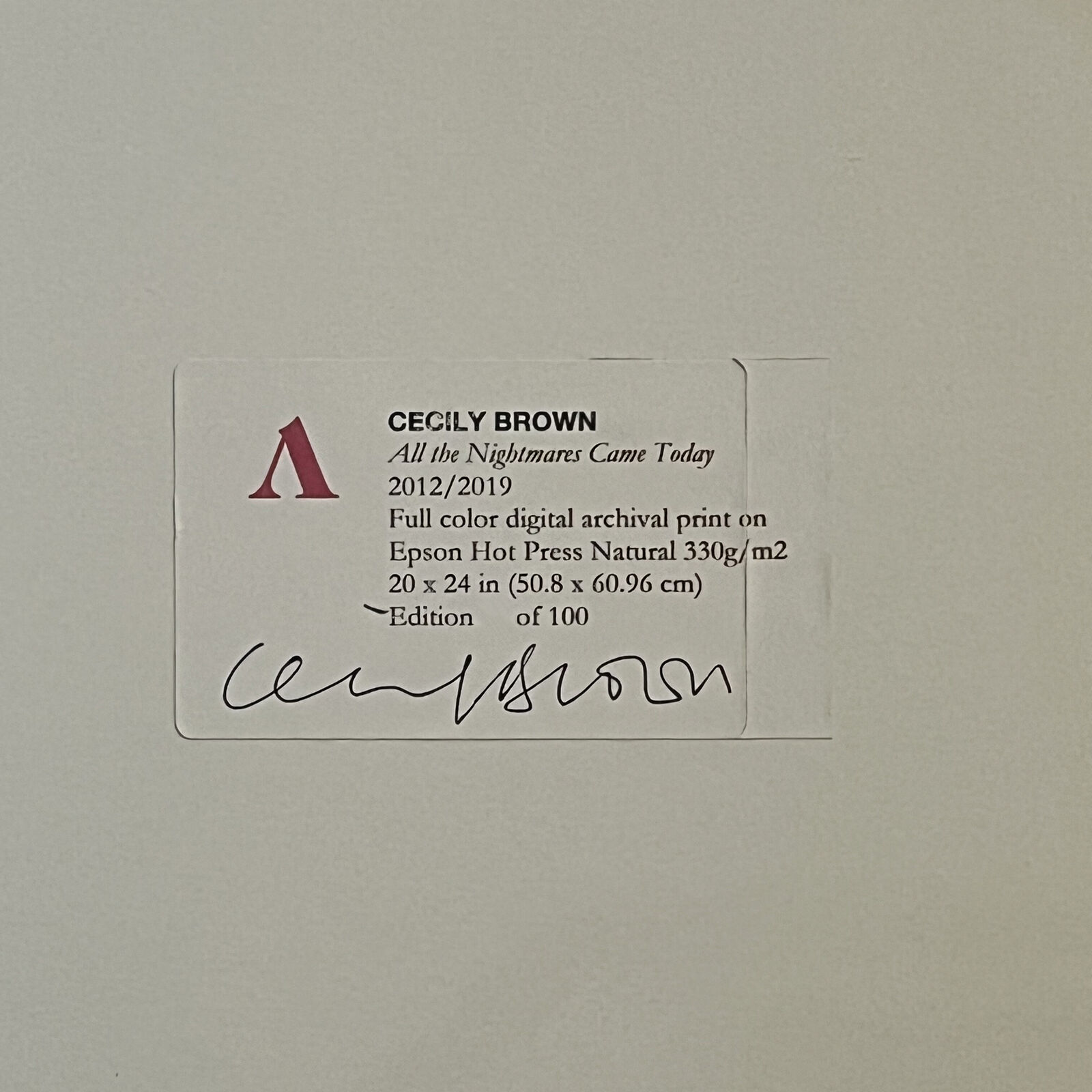 A painting of a group of people in a white frame.