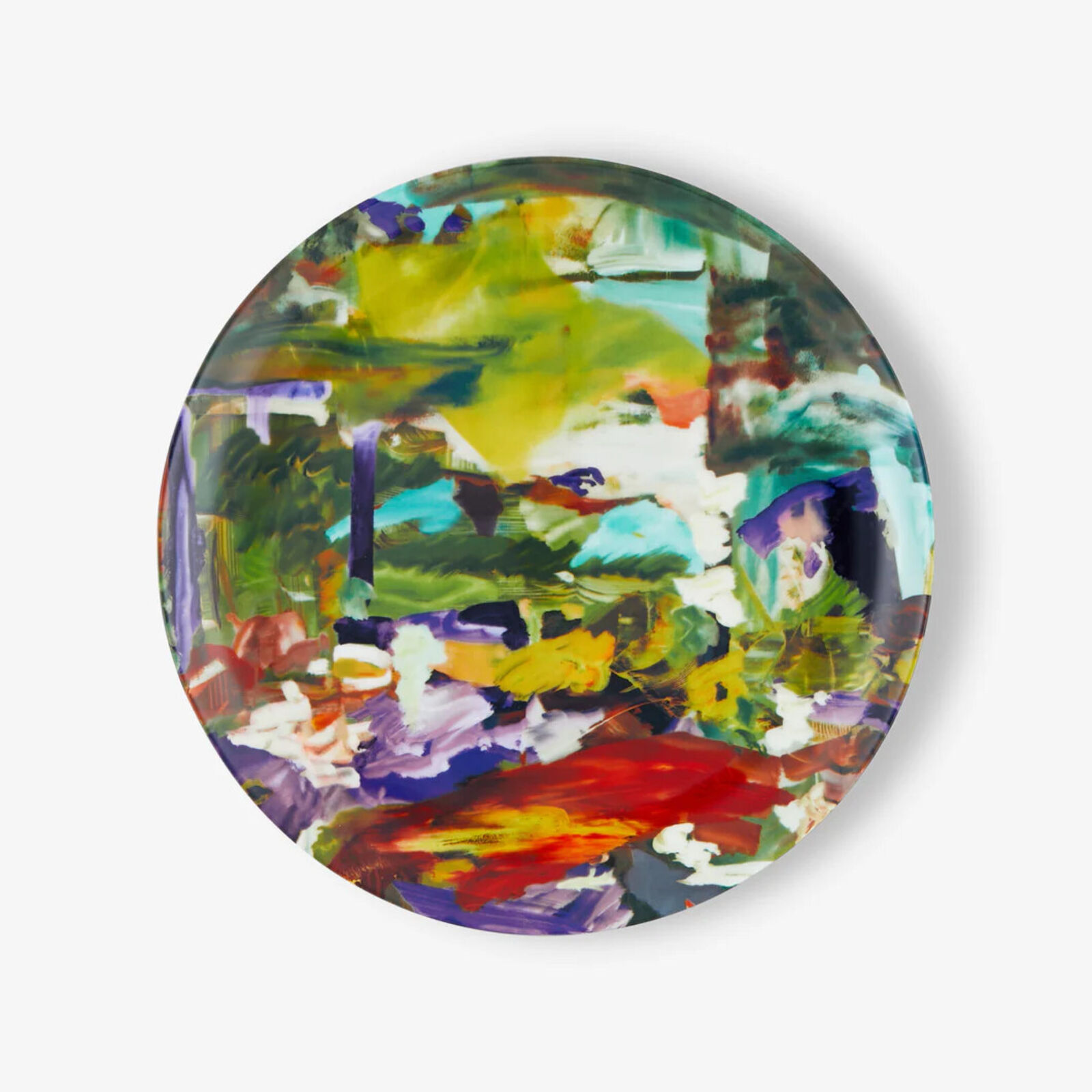 A colorful plate with a painting on it. 