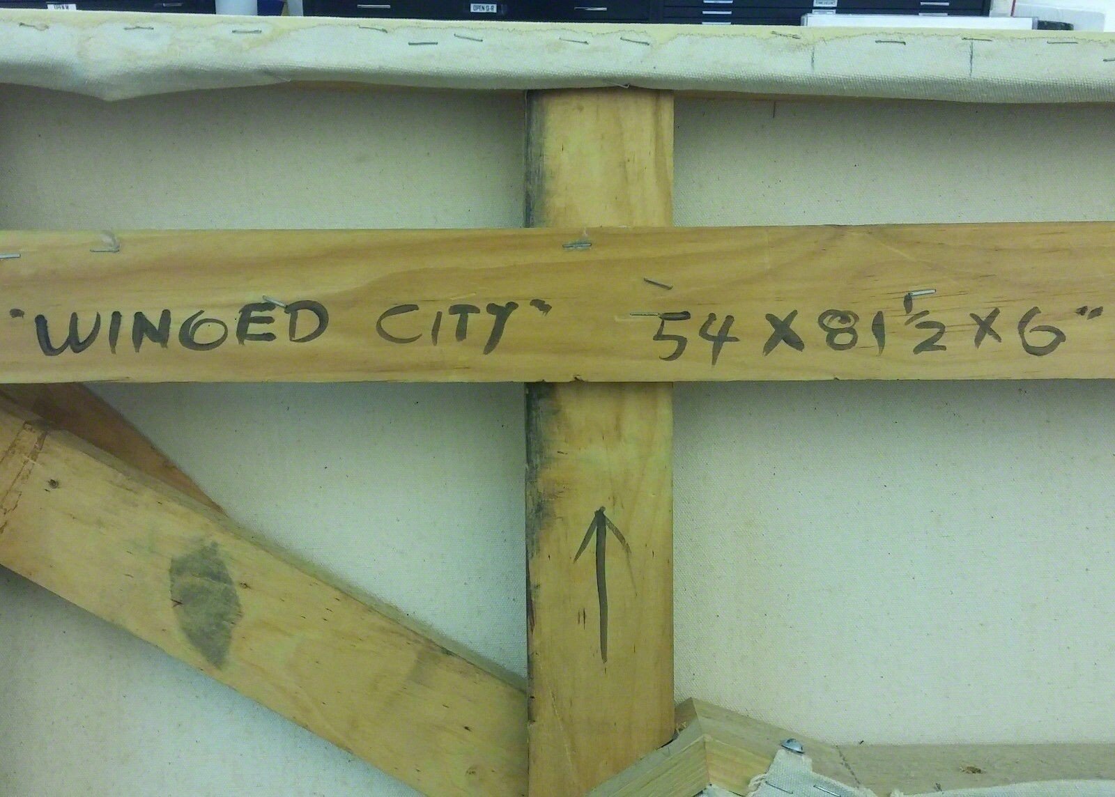 A group of different colored metal shapes on a white background.