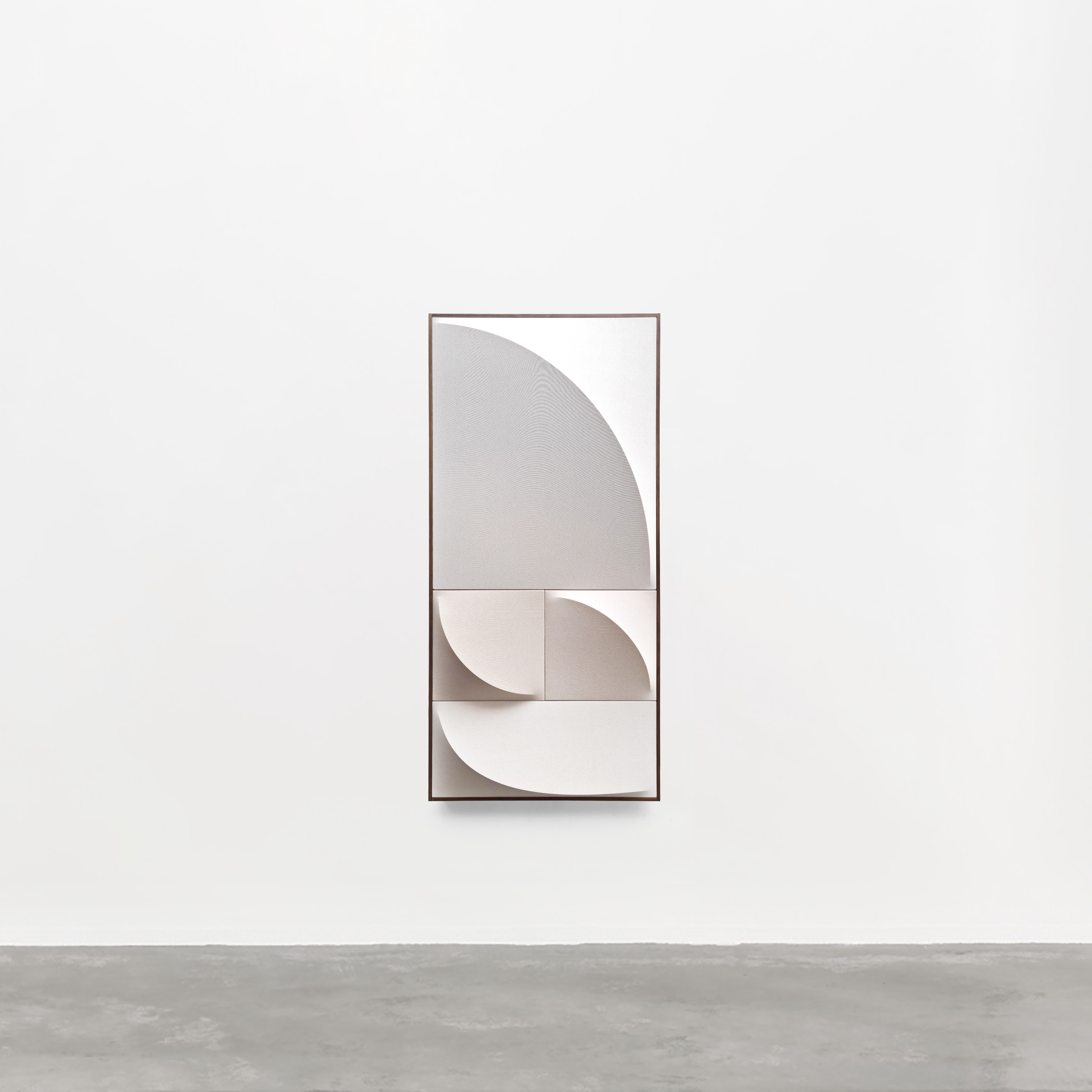 A white and brown abstract painting on a white wall.