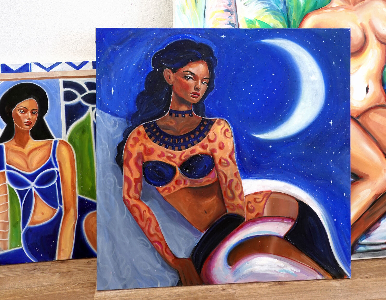 A painting of a woman sitting on a rock with a moon in the background.