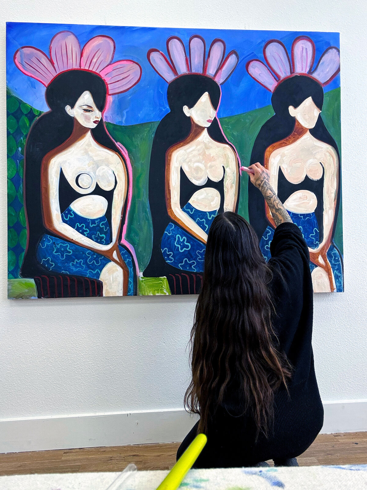 A painting of three women sitting on a bench.