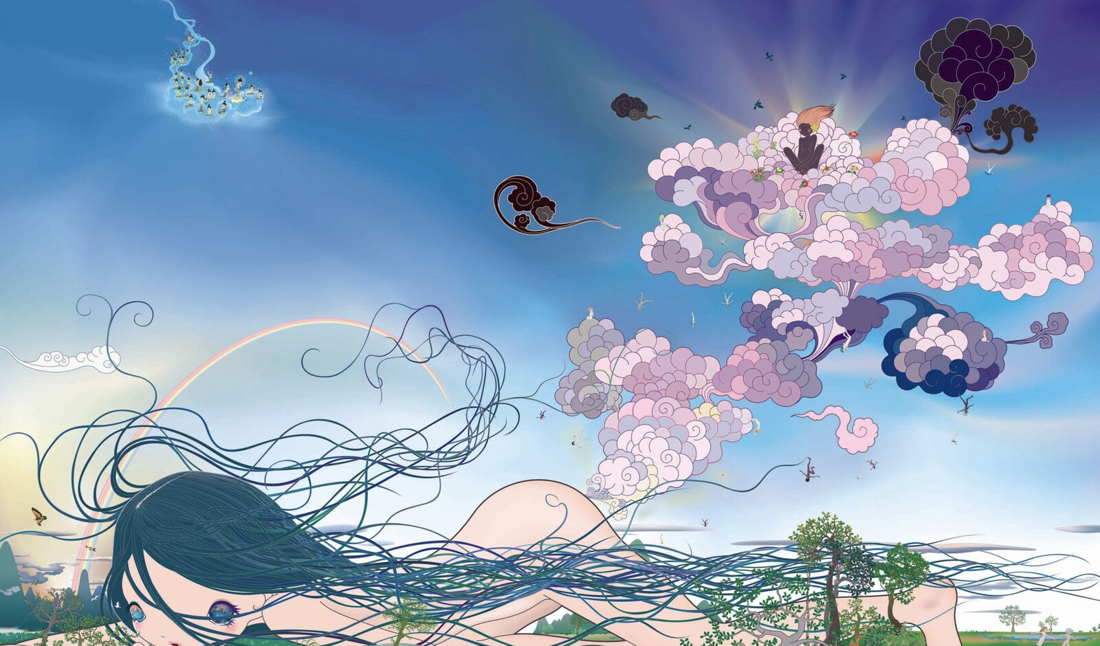 A woman laying on the ground with a rainbow in the sky.