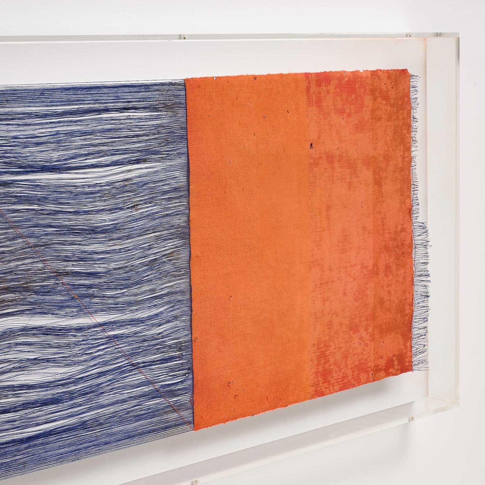 A painting hanging on a wall in front of a window.