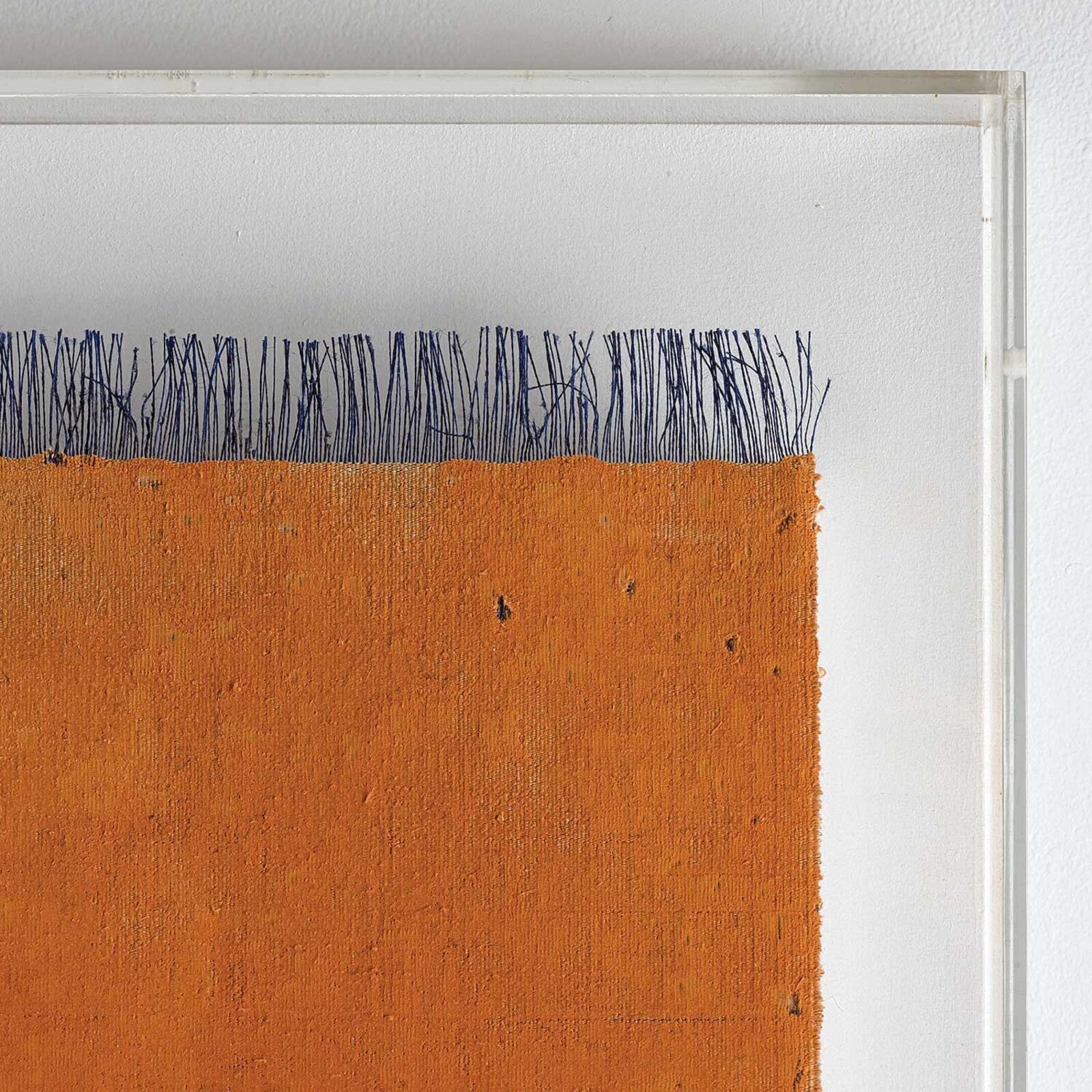 A painting hanging on a wall in front of a window.