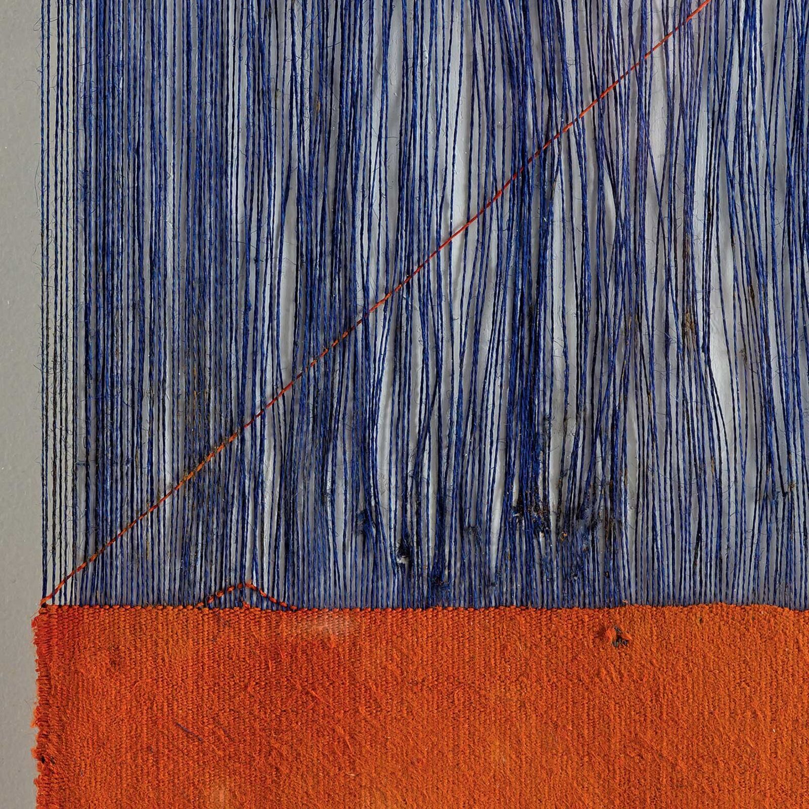 A painting hanging on a wall in front of a window.