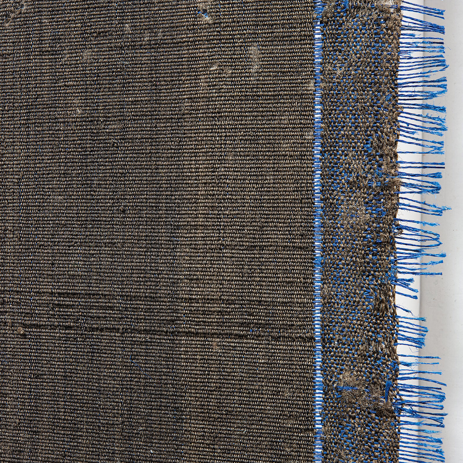 A picture hanging on a wall above a table.