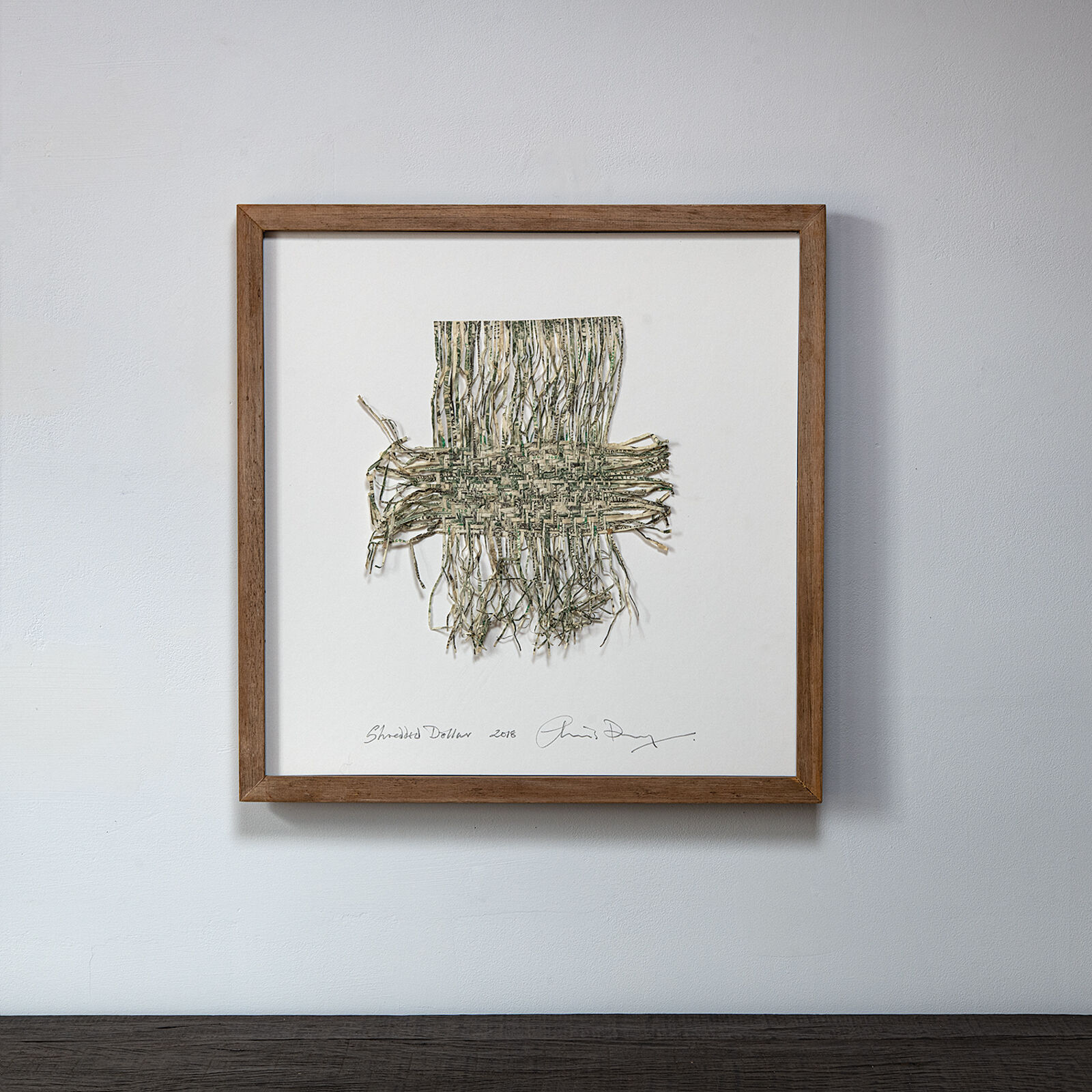 A picture hanging on a wall in a room.