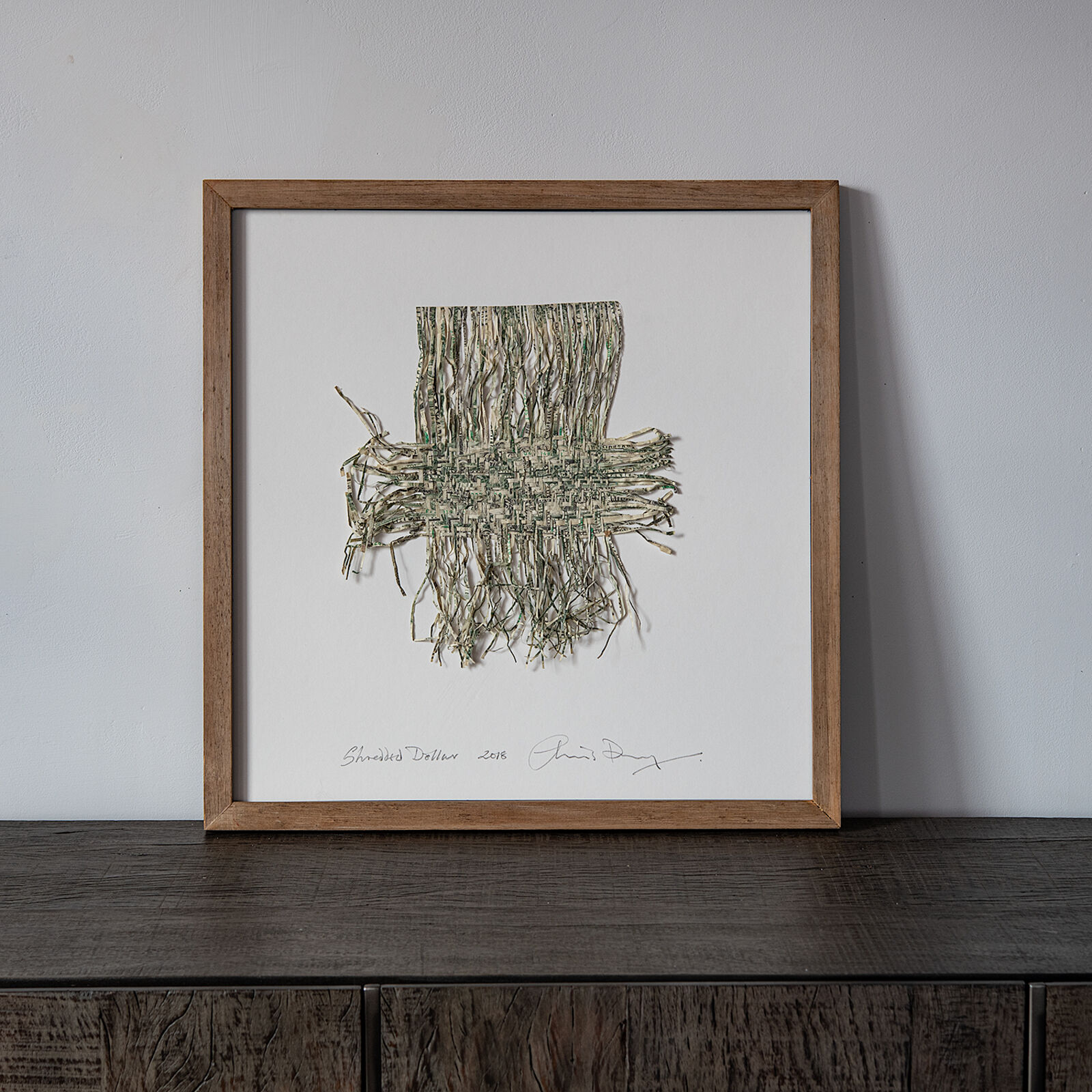 A picture hanging on a wall in a room.