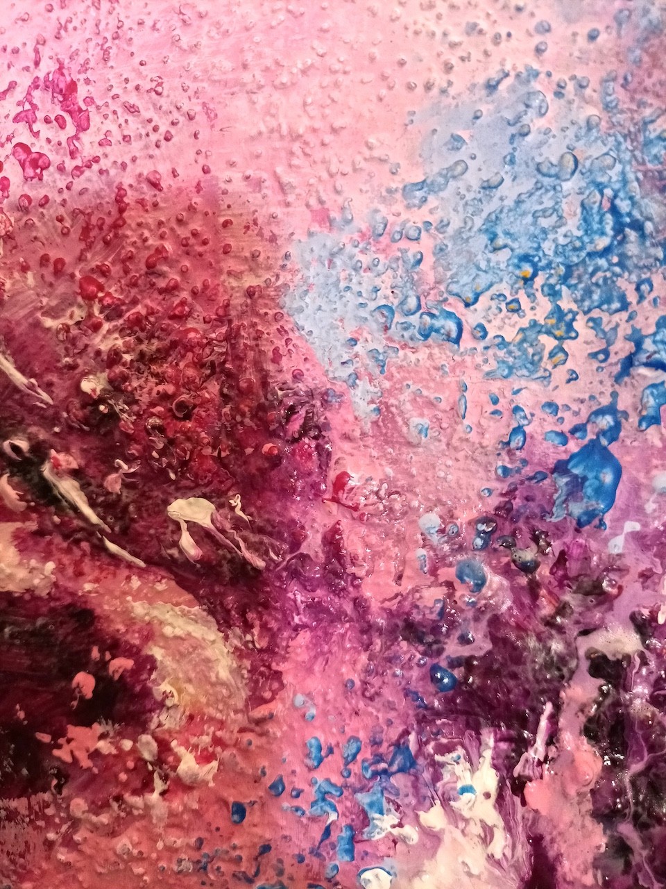 A painting of a pink and blue abstract painting.
