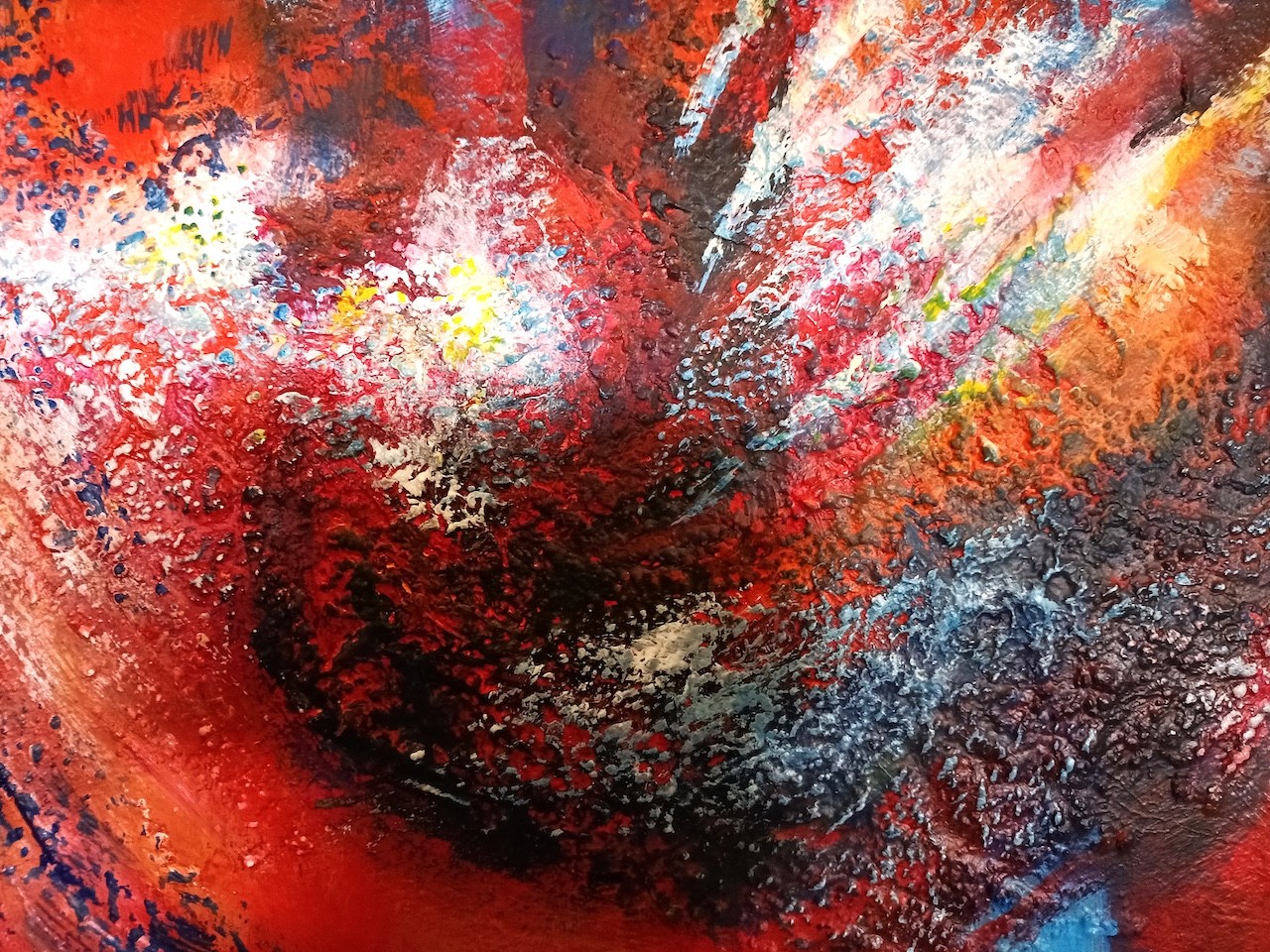 A painting hanging on a wall above a dining room table.