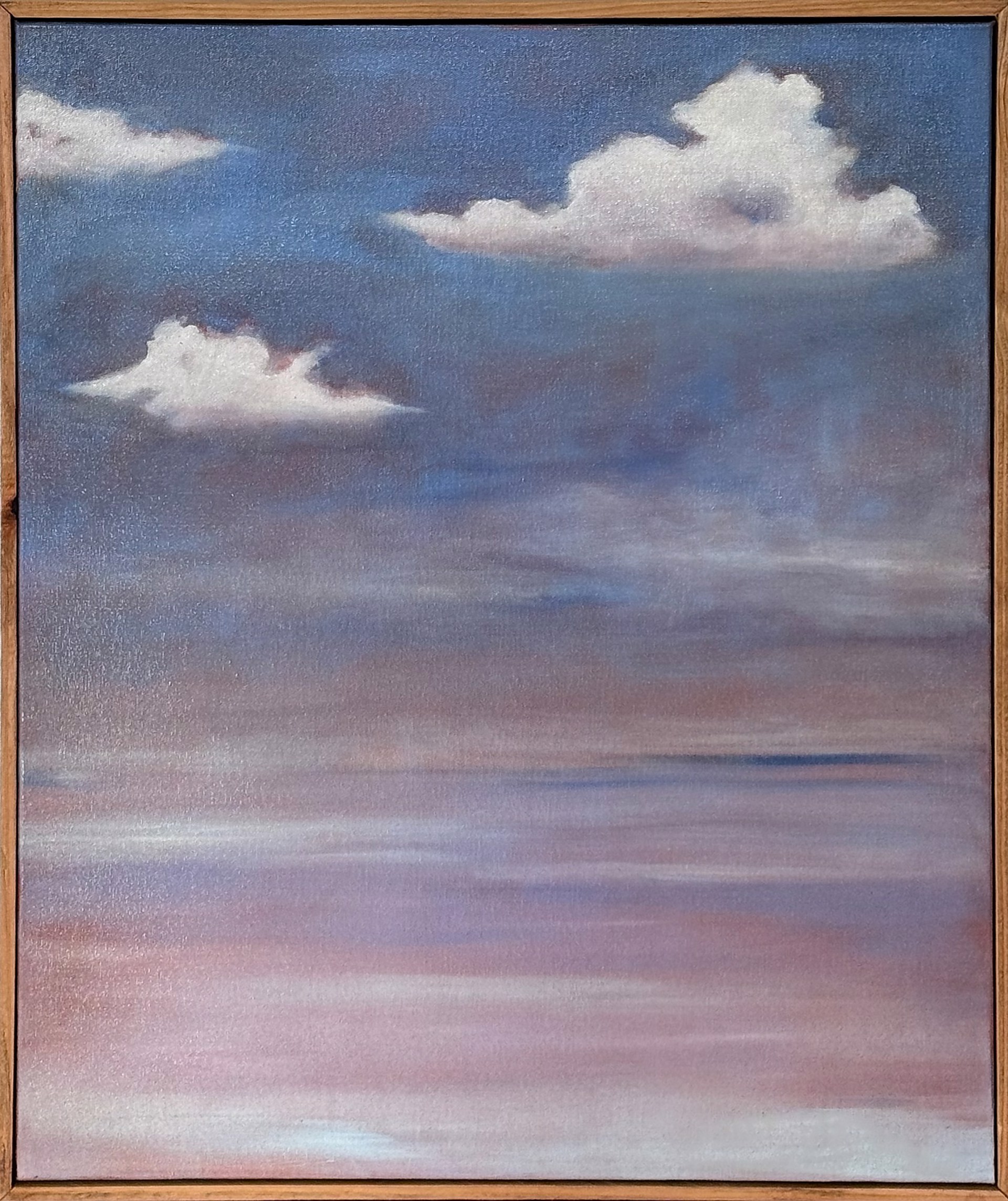 A painting of a cloudy sky in a wooden frame.