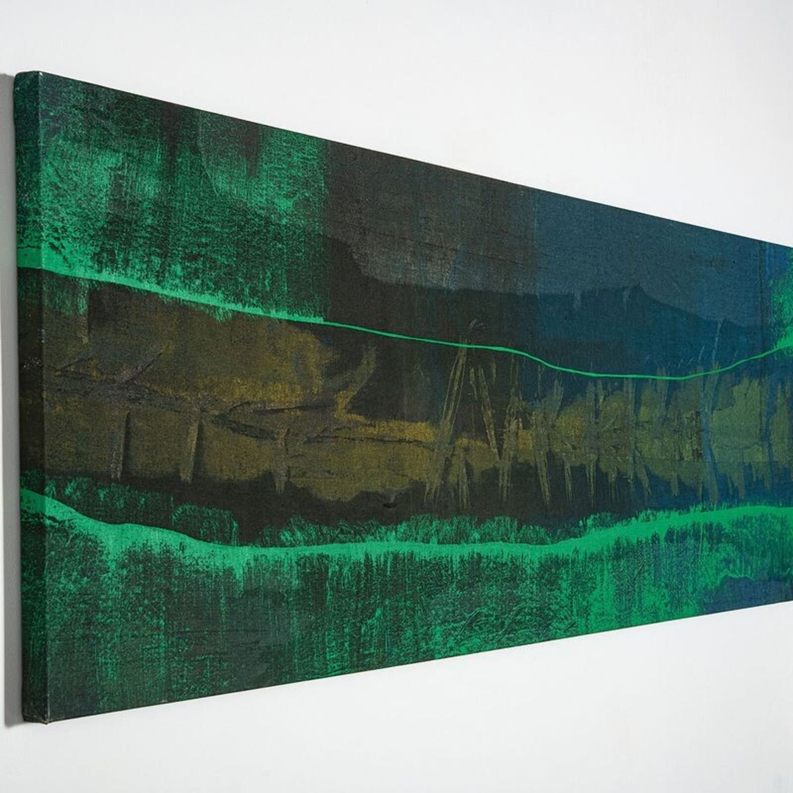 A painting hanging on a wall next to a table and chairs.