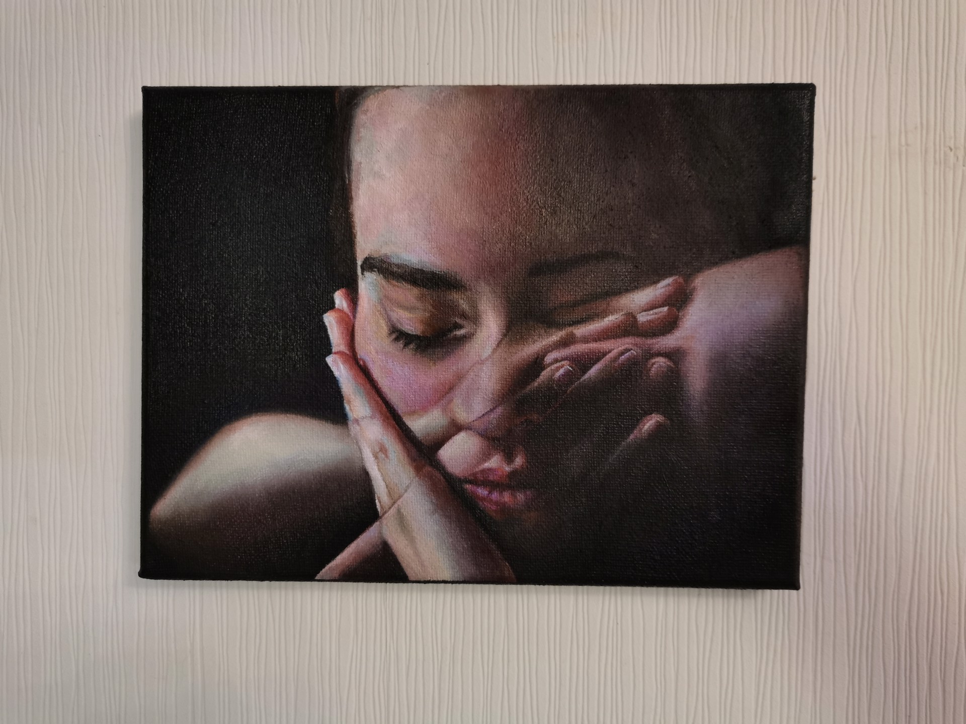 A painting of a woman covering her face with her hands.