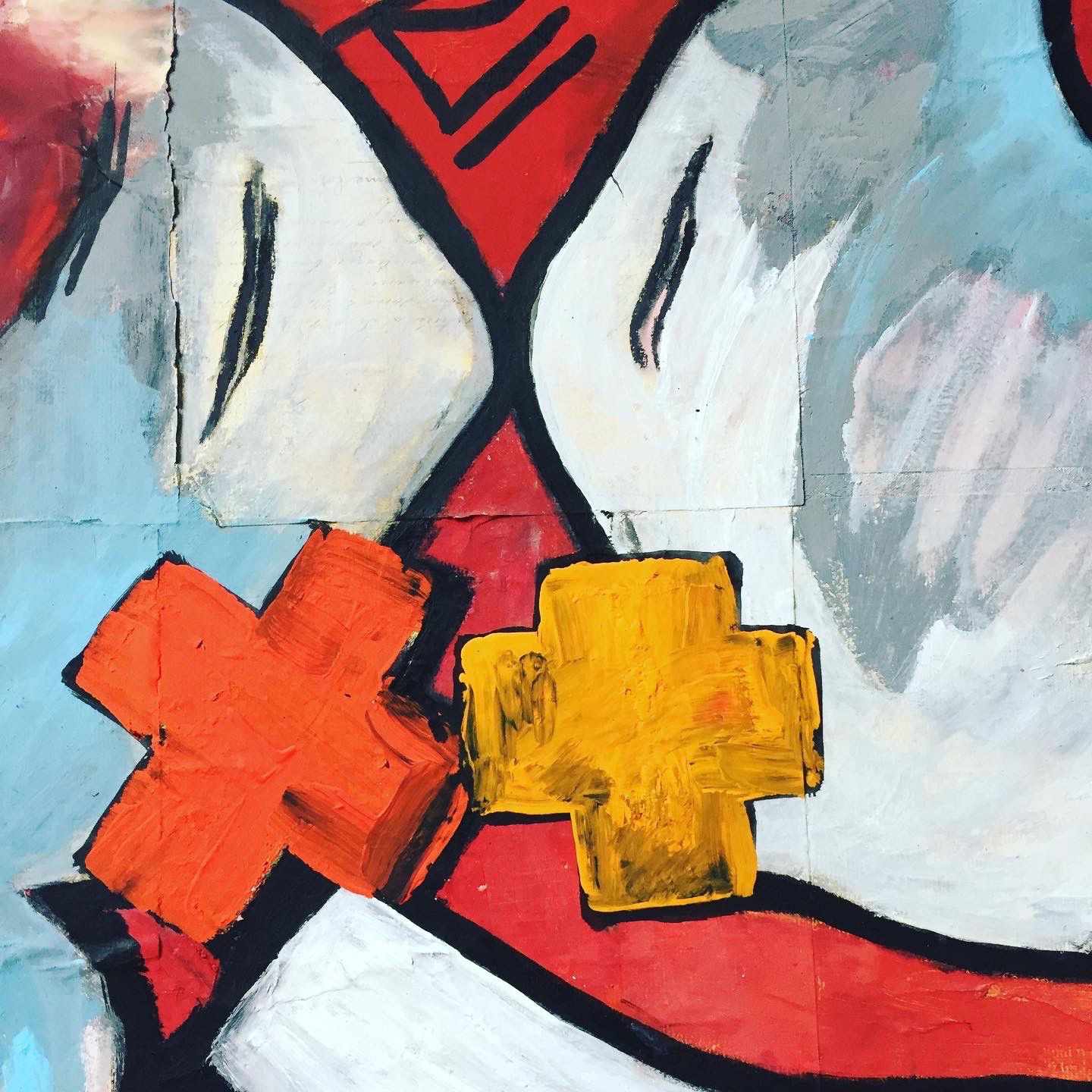 A painting of a woman's face with a yellow cross on it.