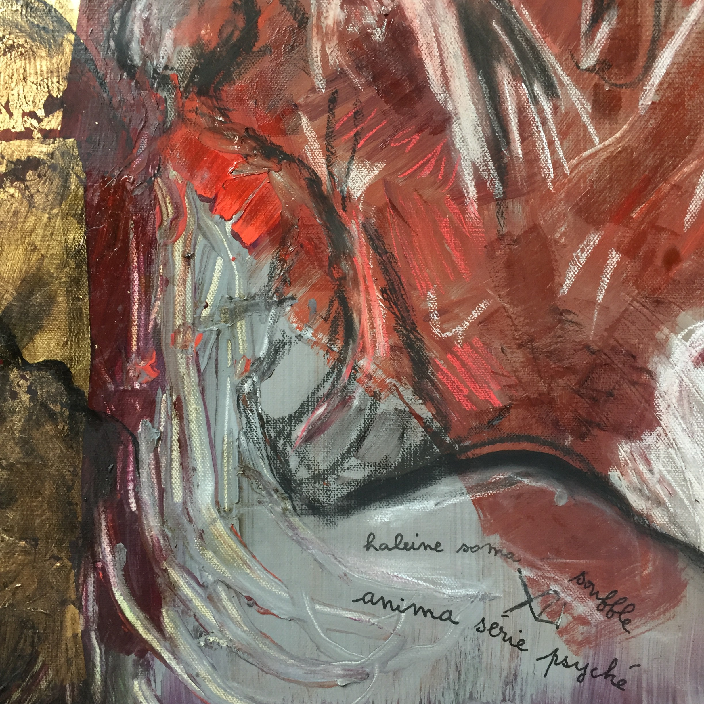 A painting of a woman's face with red and gold paint.