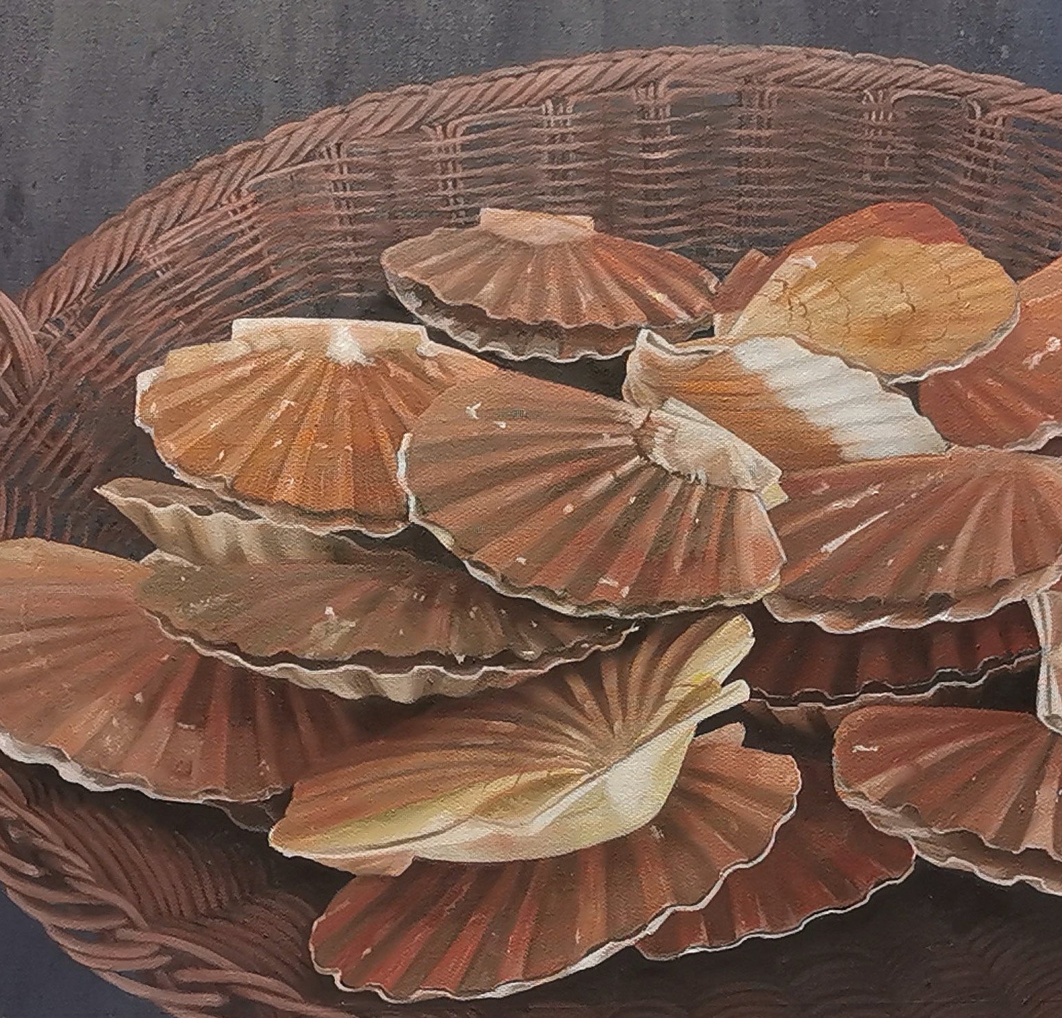 A basket full of scallops sitting on top of a table.