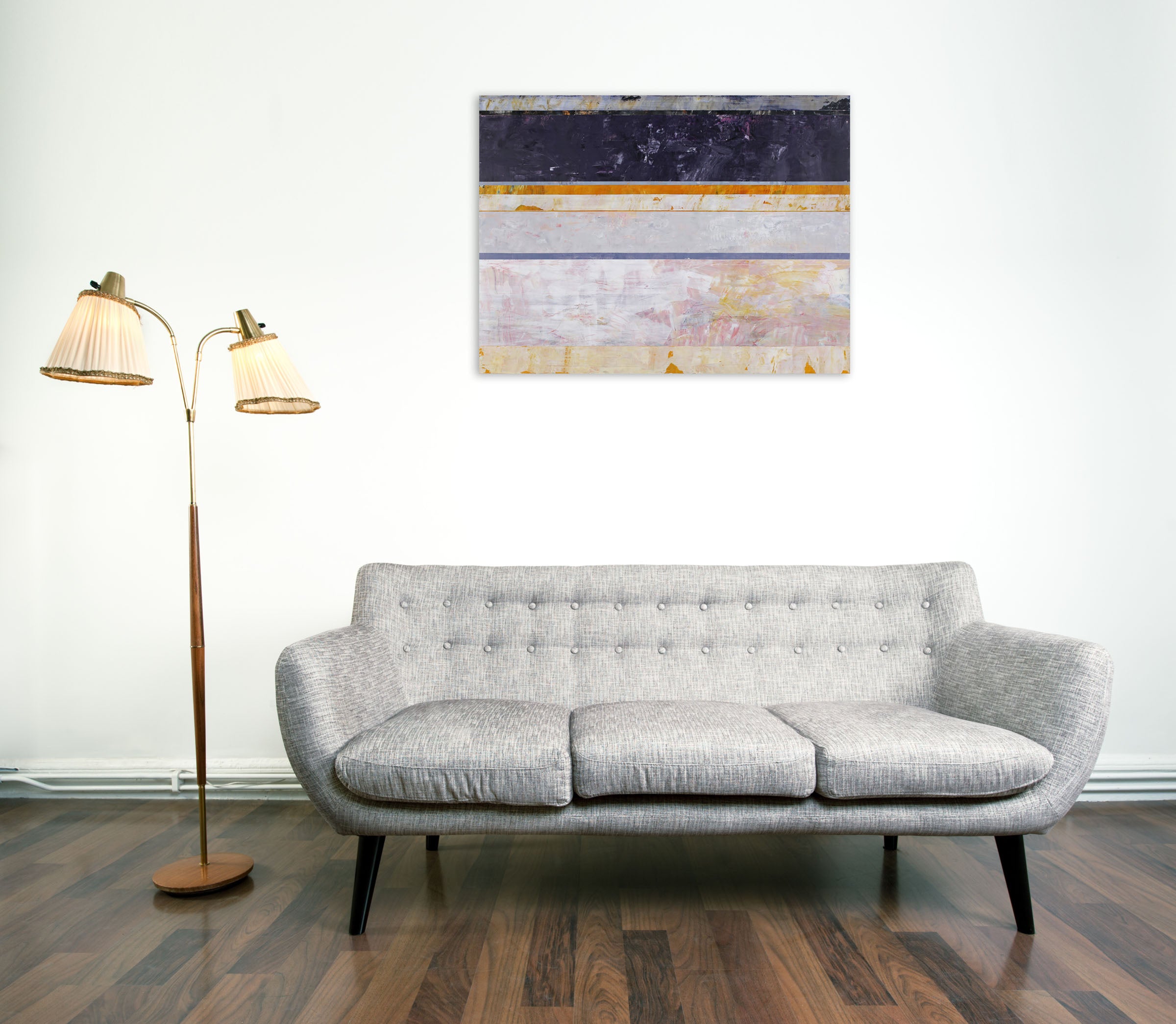 A painting on a white wall with a purple and yellow stripe.