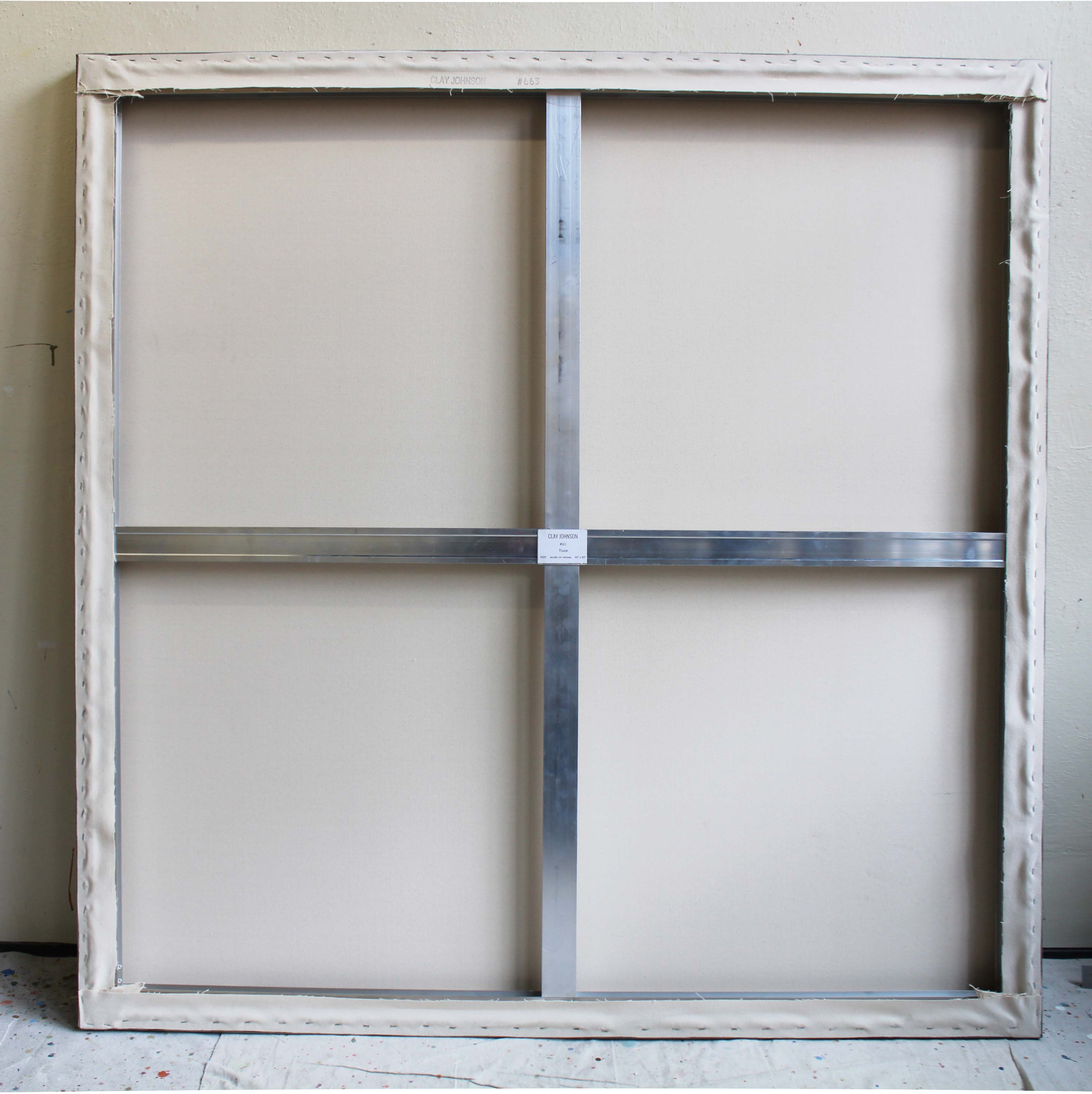 A painting on a white wall with a black and white stripe.