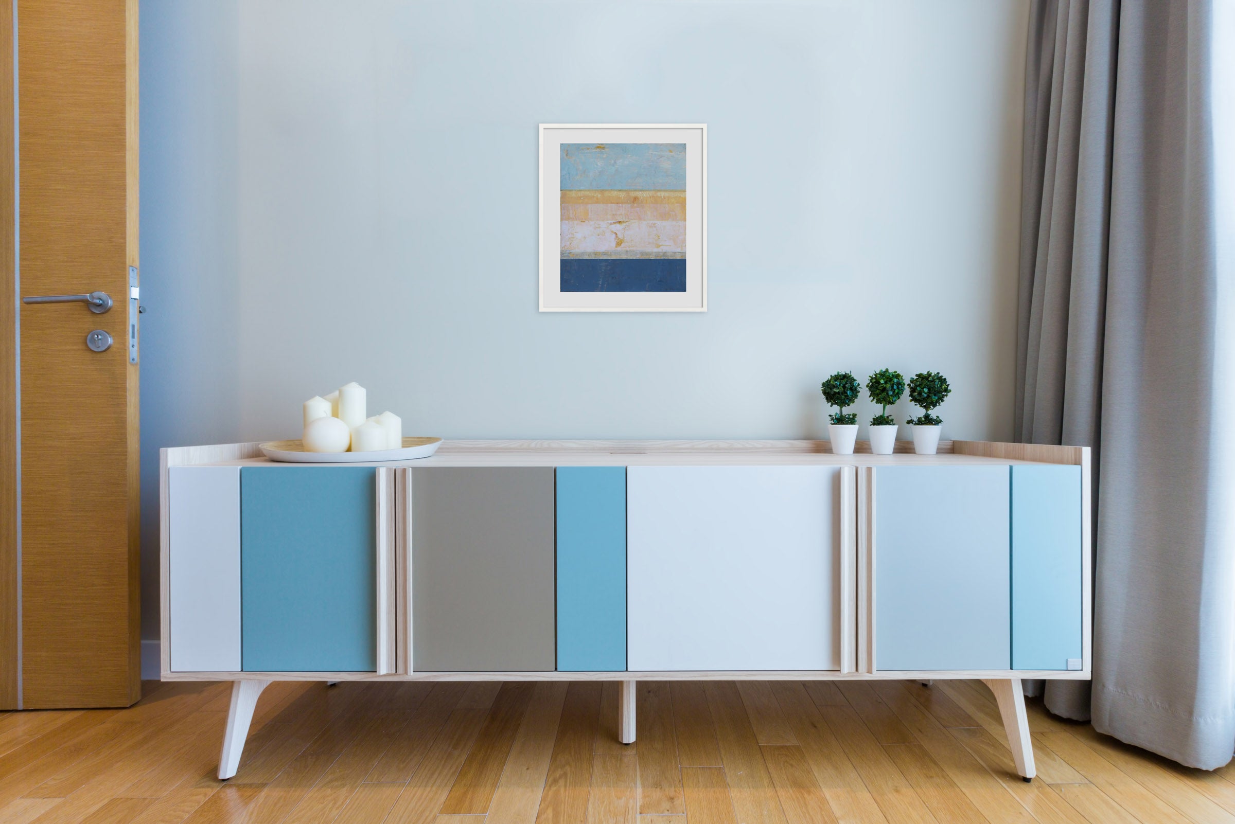 A painting of a blue and yellow striped painting on a white wall.