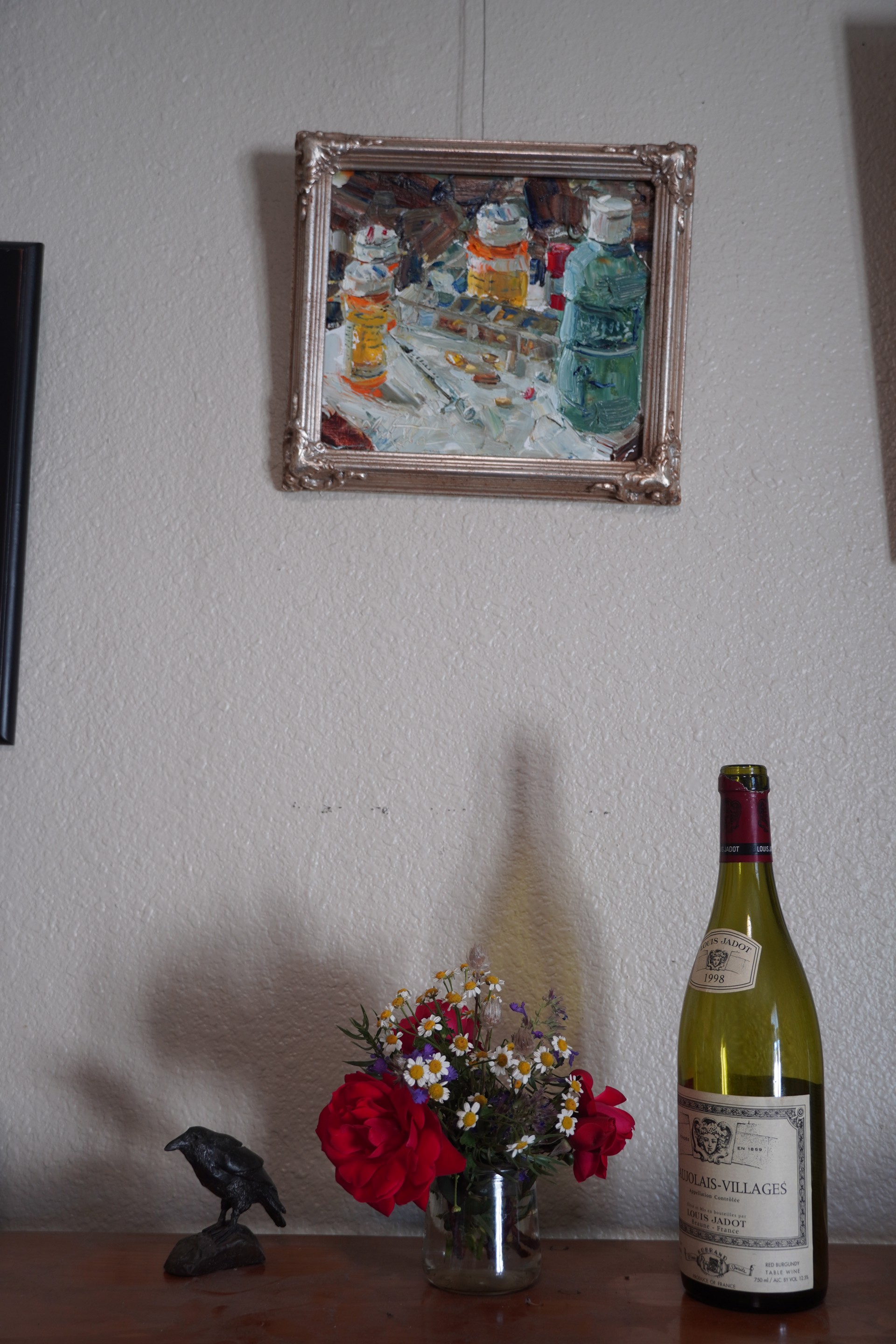 A thickly painted still life of medicine bottles and pills on a cluttered surface.