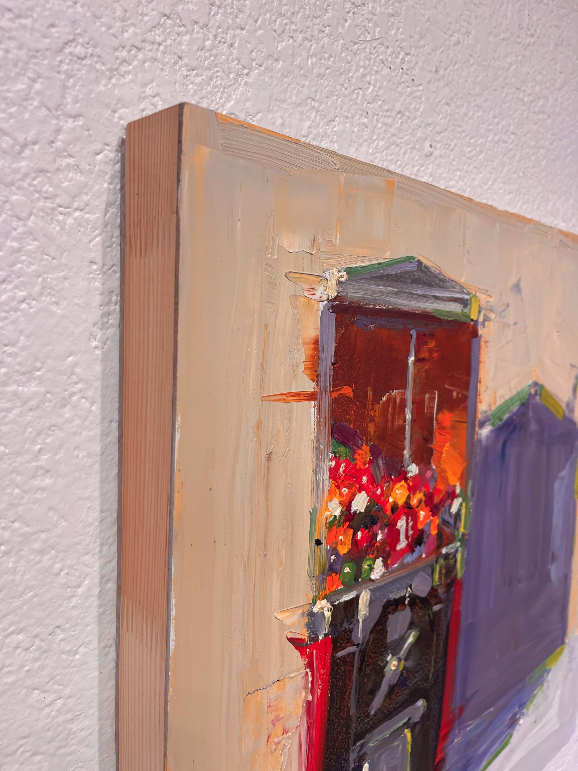 A vibrant oil painting of a flower shop with bold colors and thick brushstrokes.