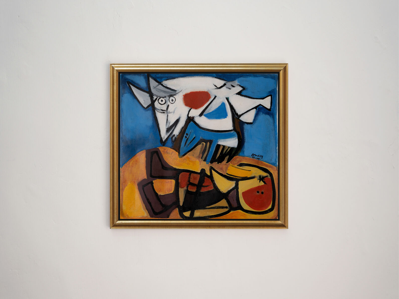 A painting hanging on a wall in a room.