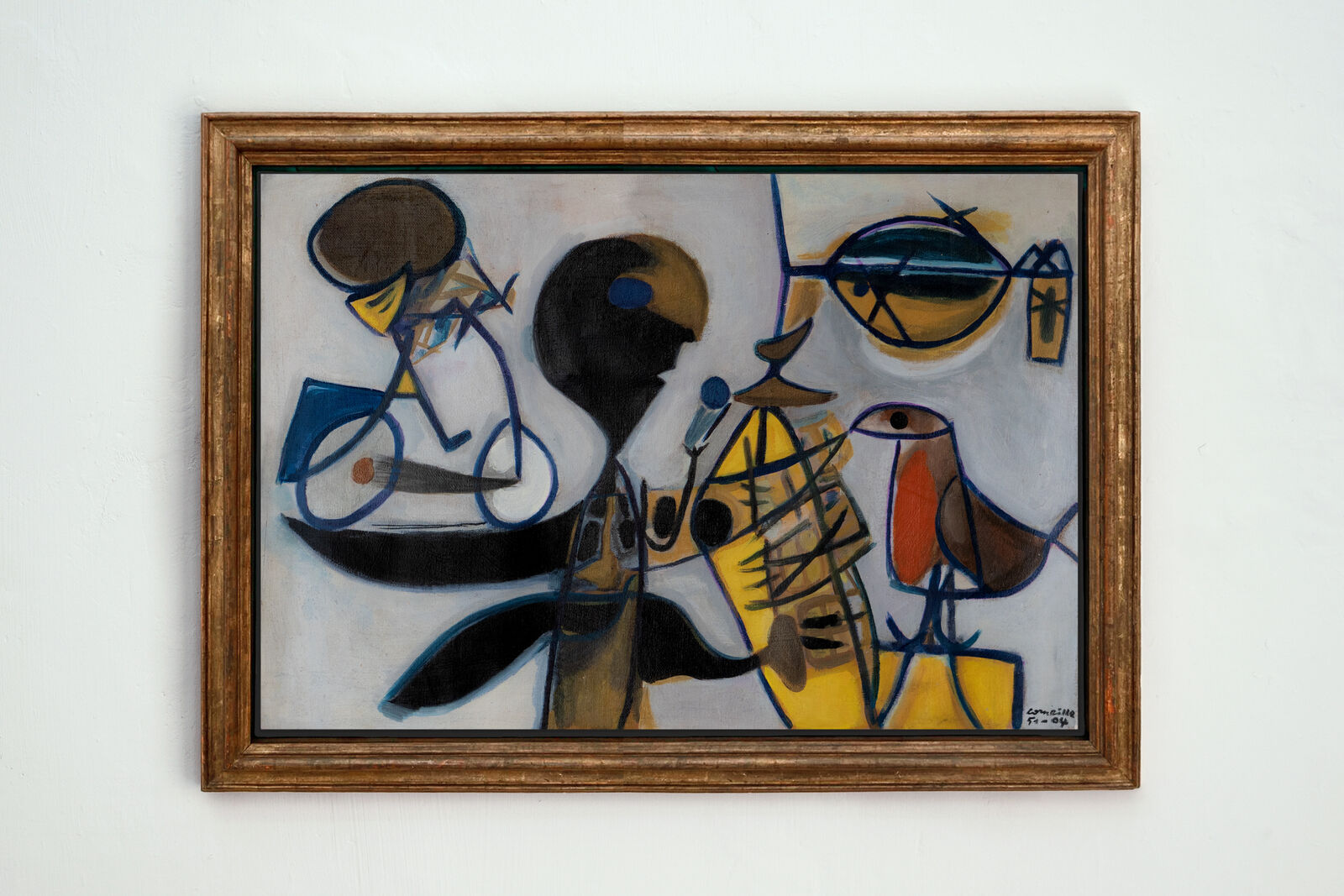 A painting hanging on a wall in a room.