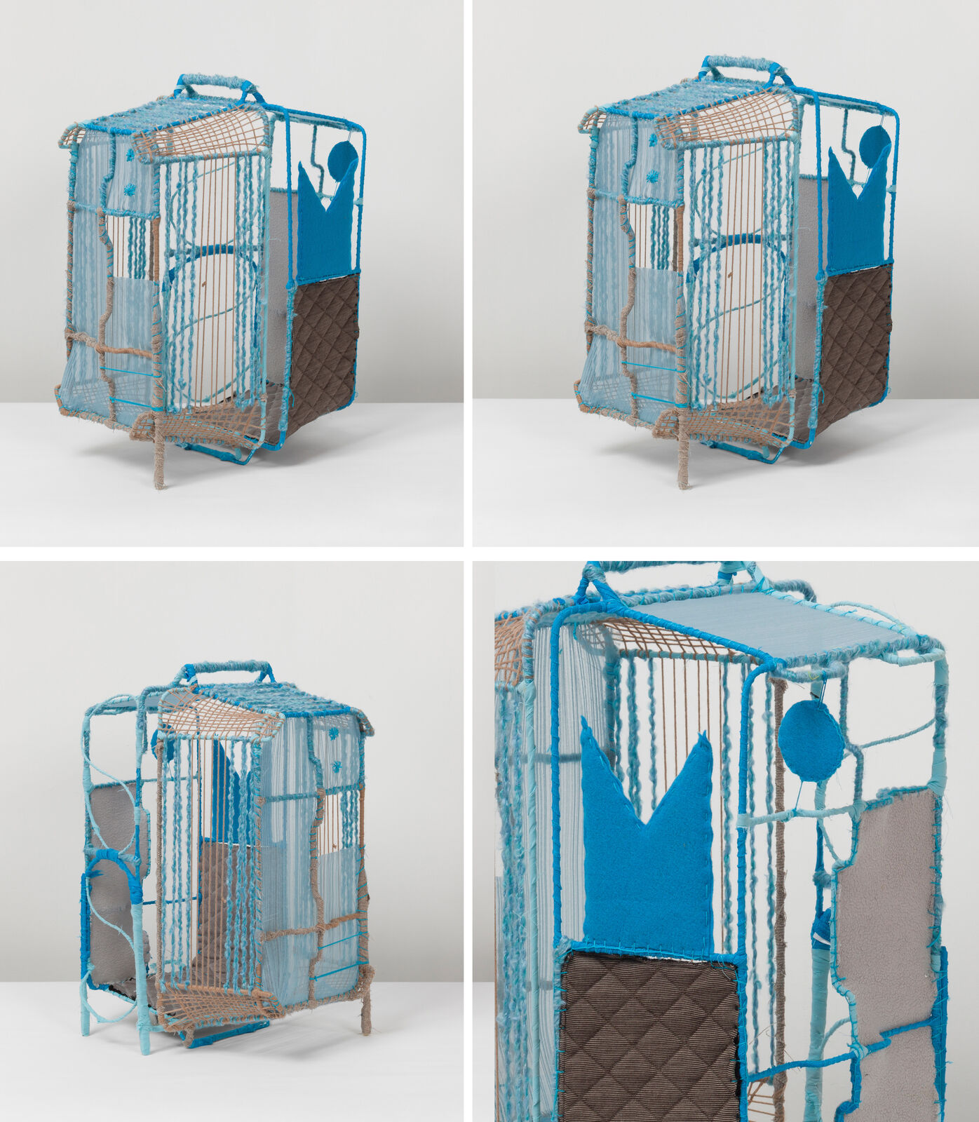 A woven, cage-like sculpture featuring blue and brown yarns with a stylized figure silhouette.