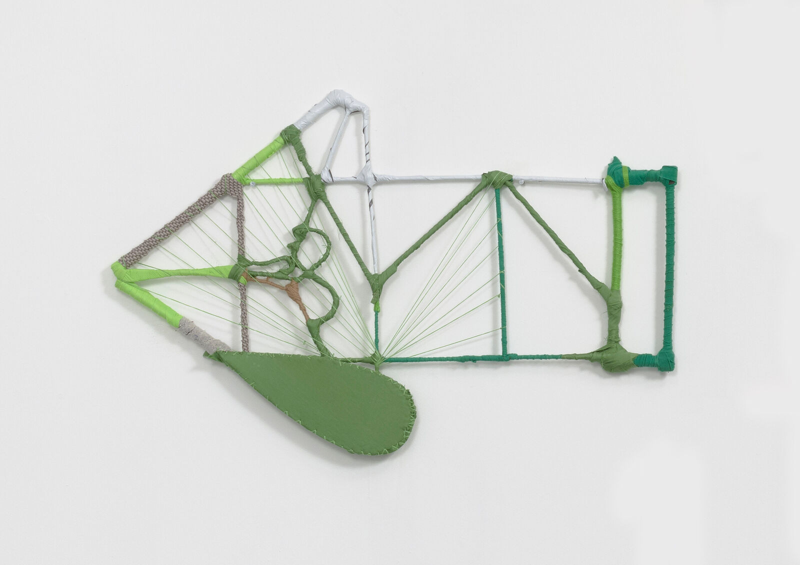 A wireframe sculpture of a biplane constructed from wrapped rods and string.