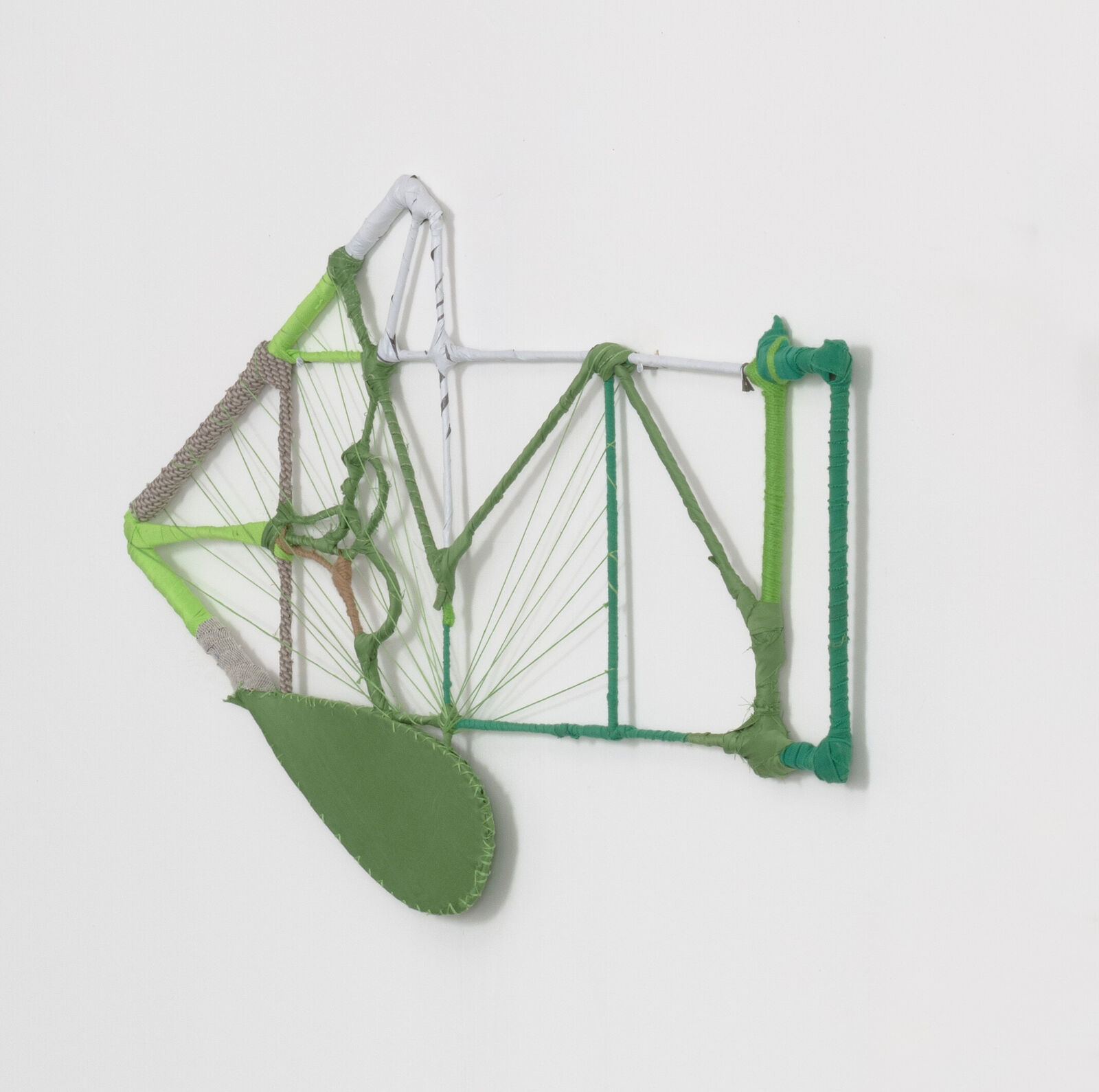 A wireframe sculpture of a biplane constructed from wrapped rods and string.