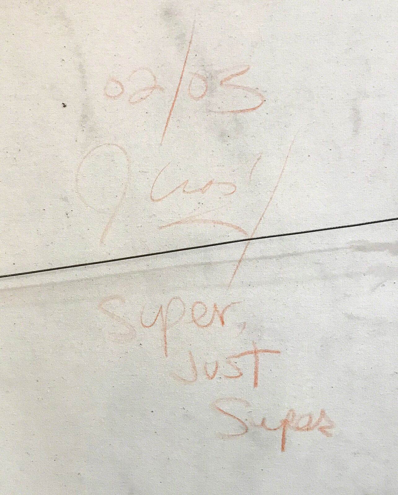 A painting of a woman's face on a wall.