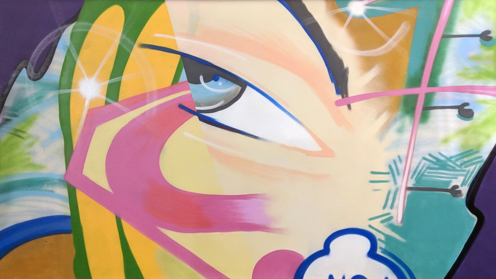 A painting of a woman's face on a wall.