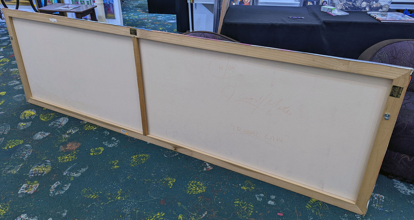 a close up of a painting of a woman's face on a wall