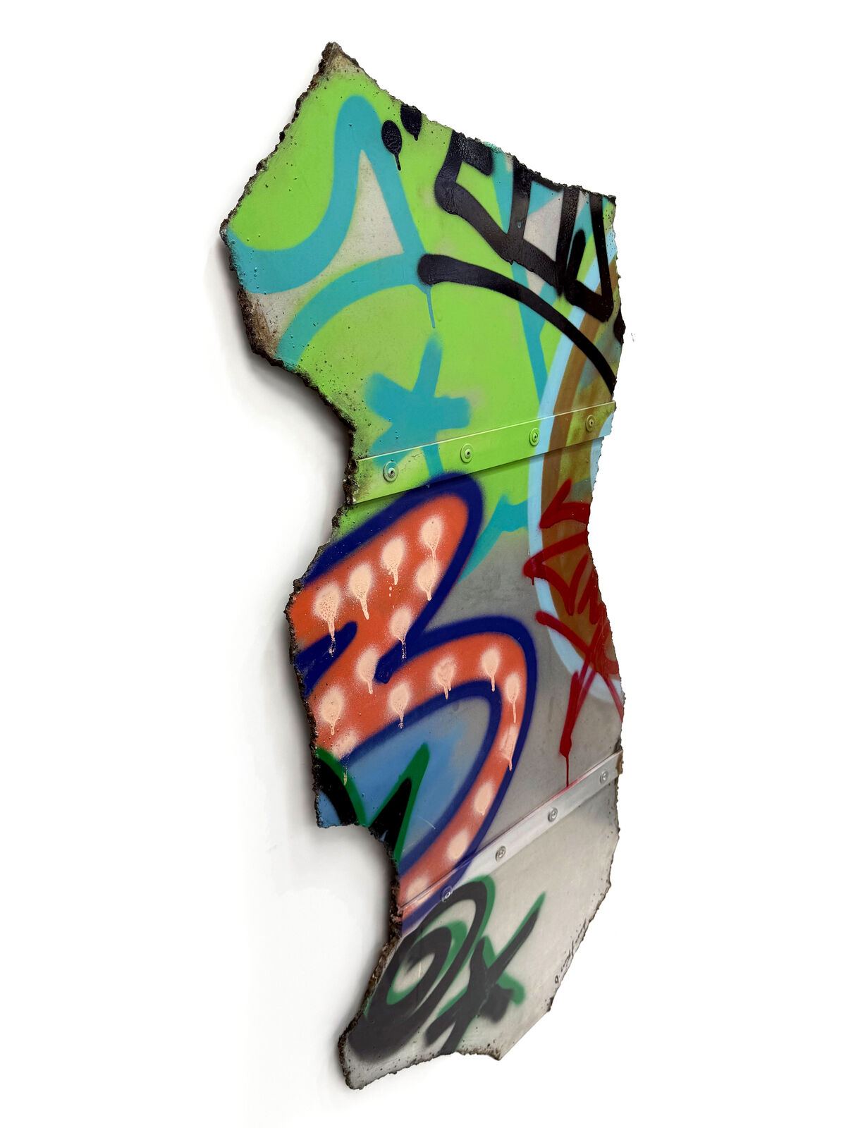 A piece of metal with graffiti on it. 