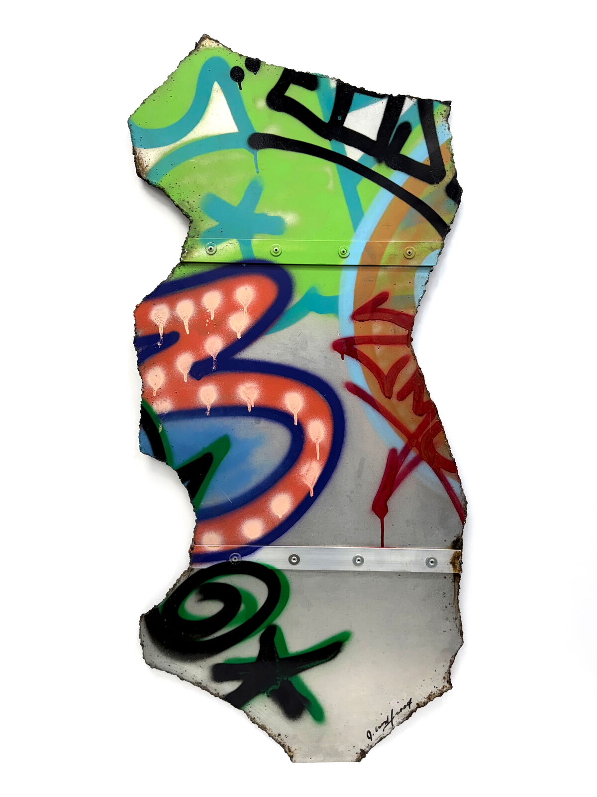 A piece of metal with graffiti on it. 