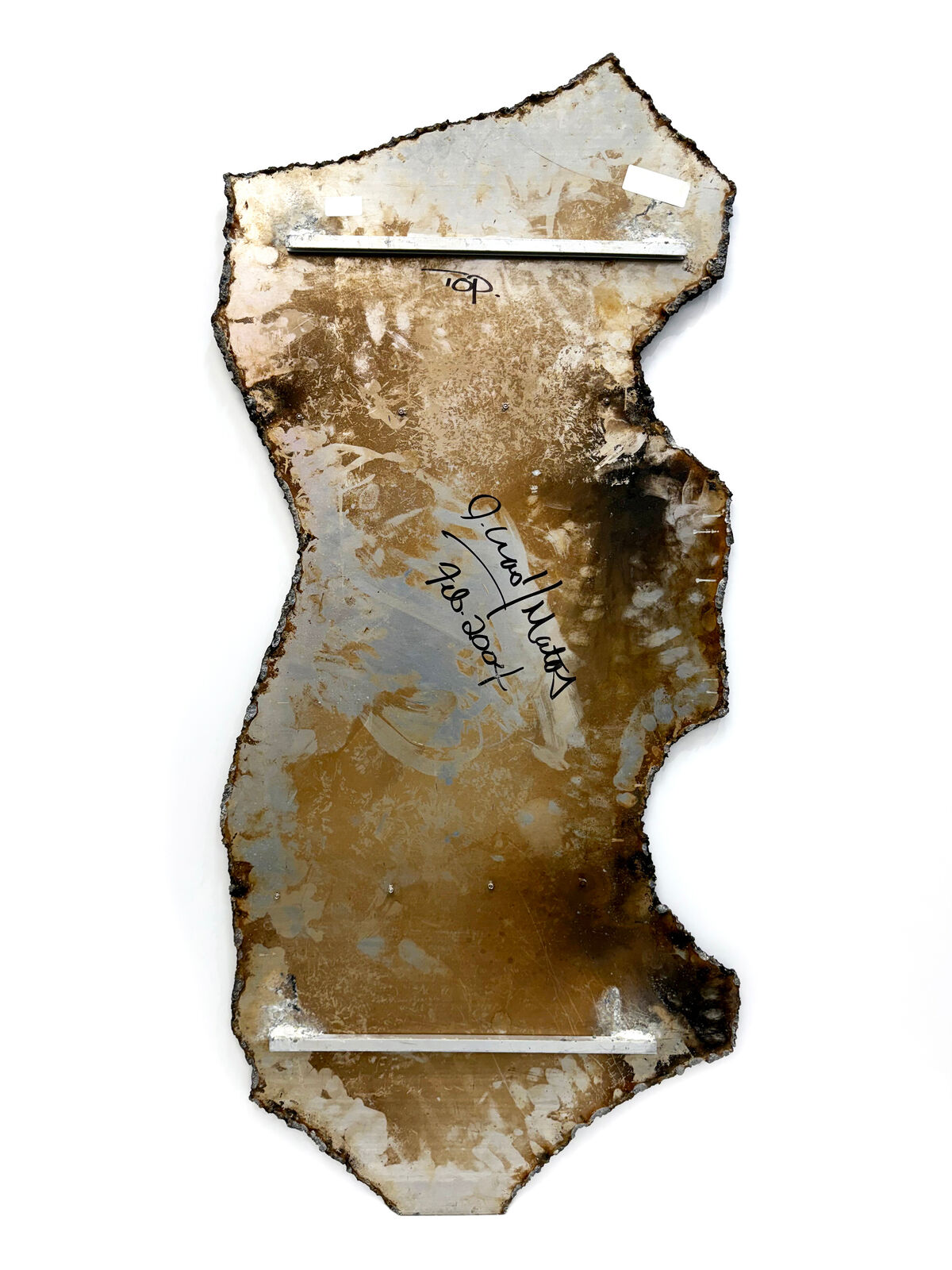 A piece of metal with graffiti on it. 