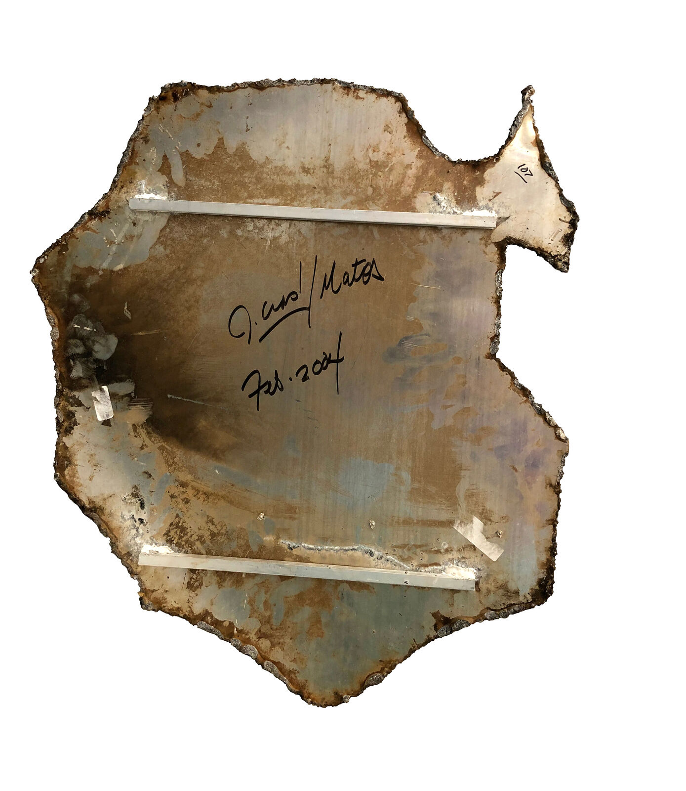 A piece of metal with graffiti on it. 