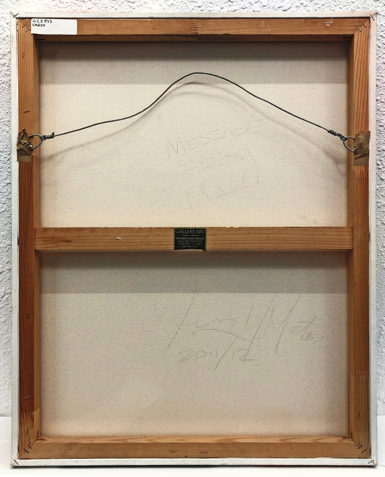 A painting on a white wall with a sun in the background.