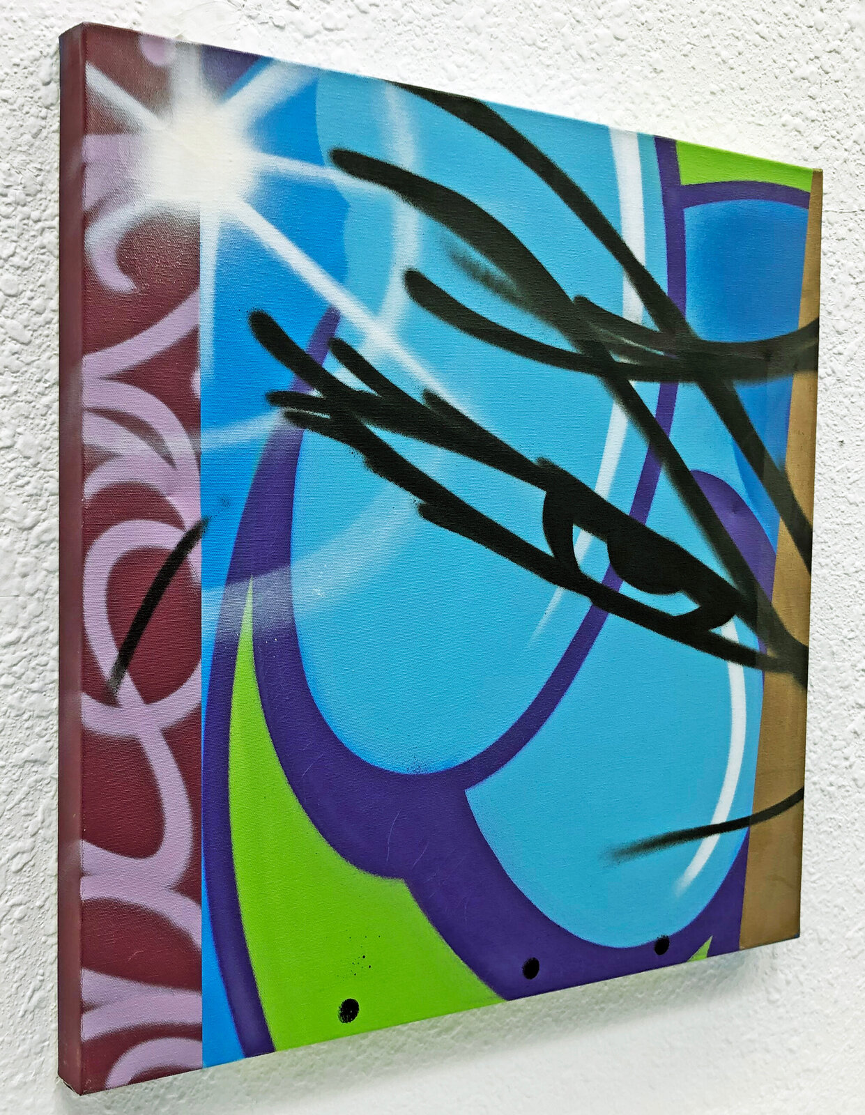 A painting on a wall with a blue and green background.