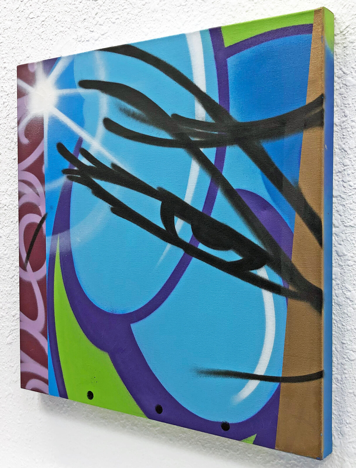 A painting on a wall with a blue and green background.
