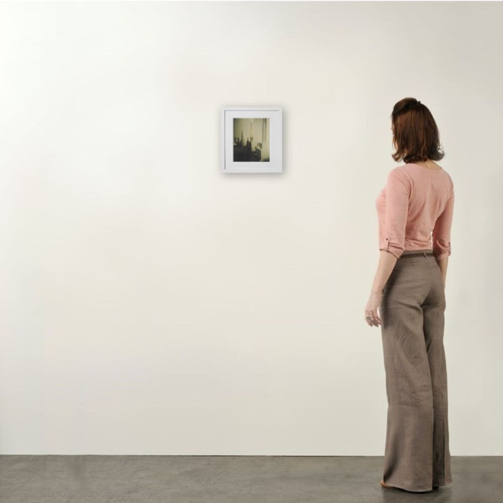 A black and white photo of a room with a white frame.