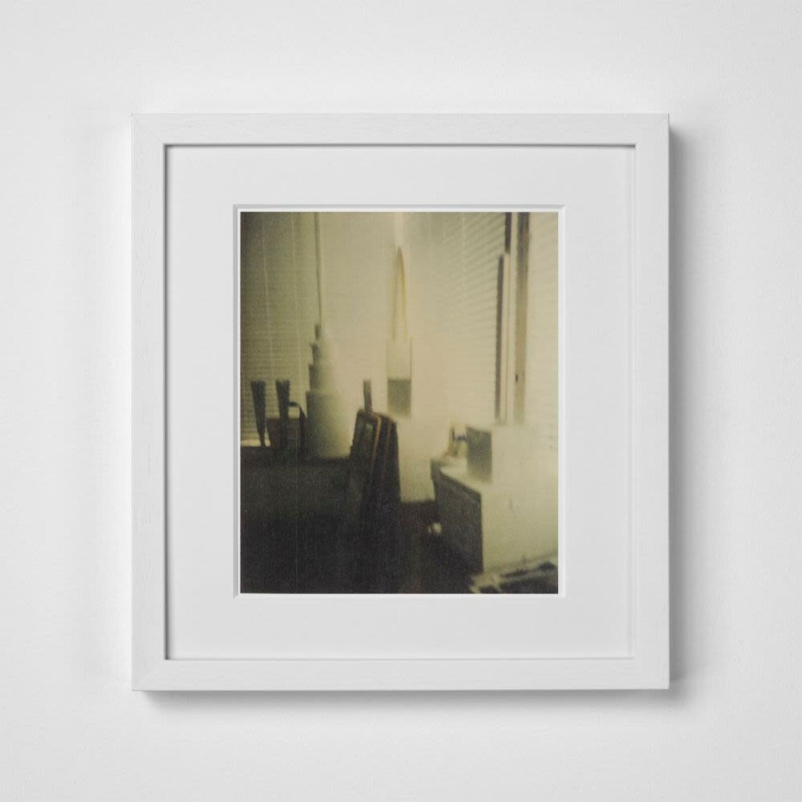 A black and white photo of a room with a white frame.