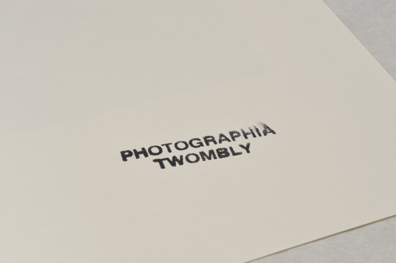 A picture of a white frame on a wall in a room.