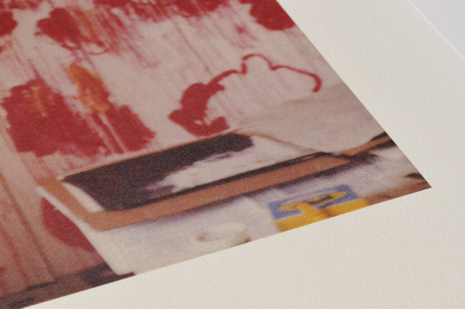 A picture of a white frame on a wall in a room.